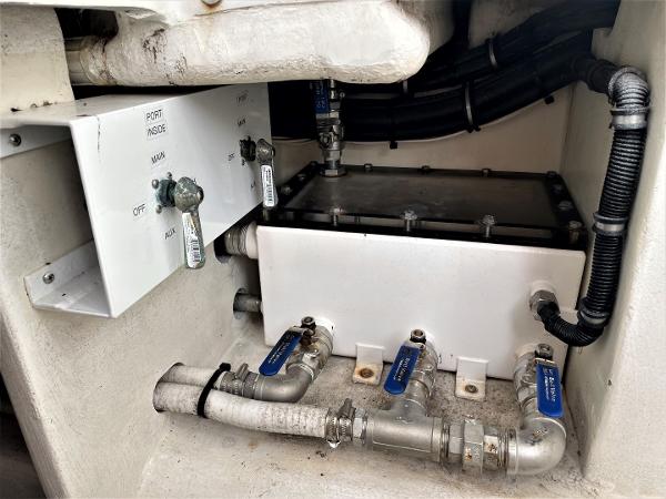 2020 Front Runner 39 Center Console plumbing system with valves and pipes.
