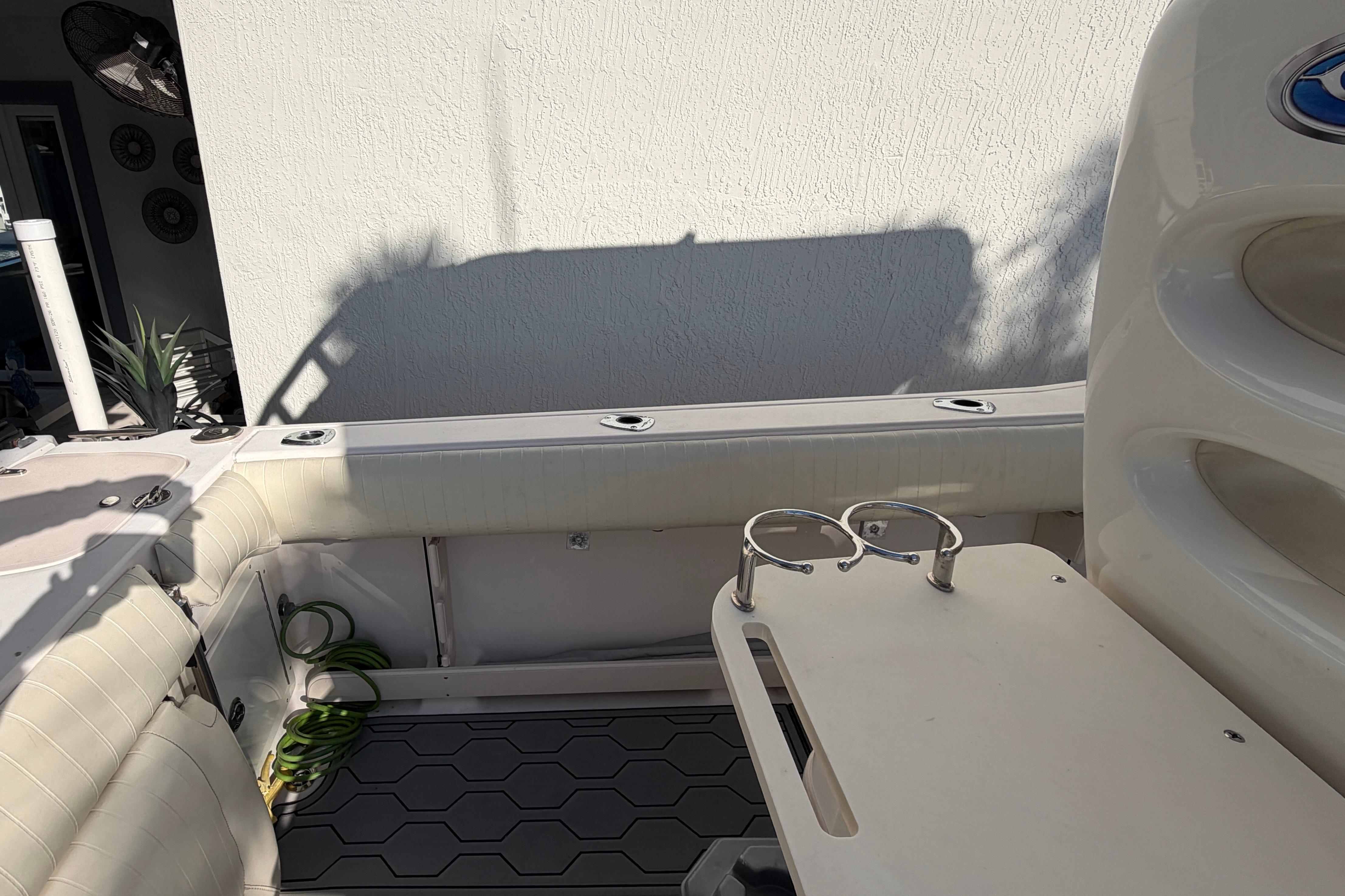 2004 Grady White 273 boat interior with seating and cup holders.