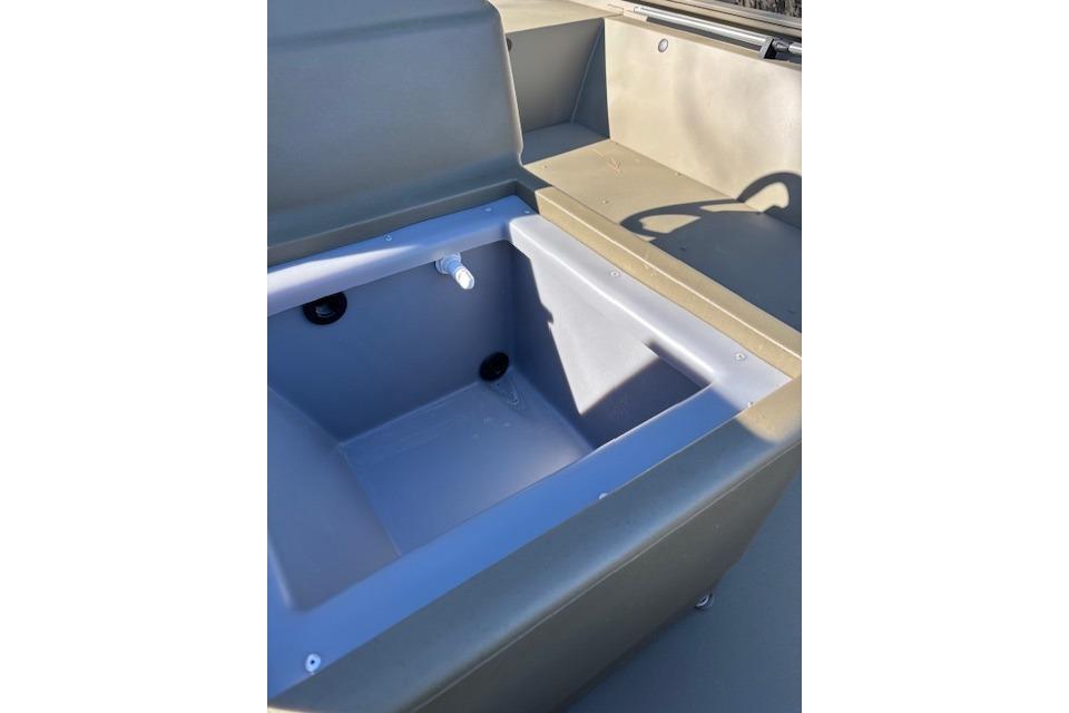 2026 Tracker Grizzly 1648 SC boat interior with storage compartment.
