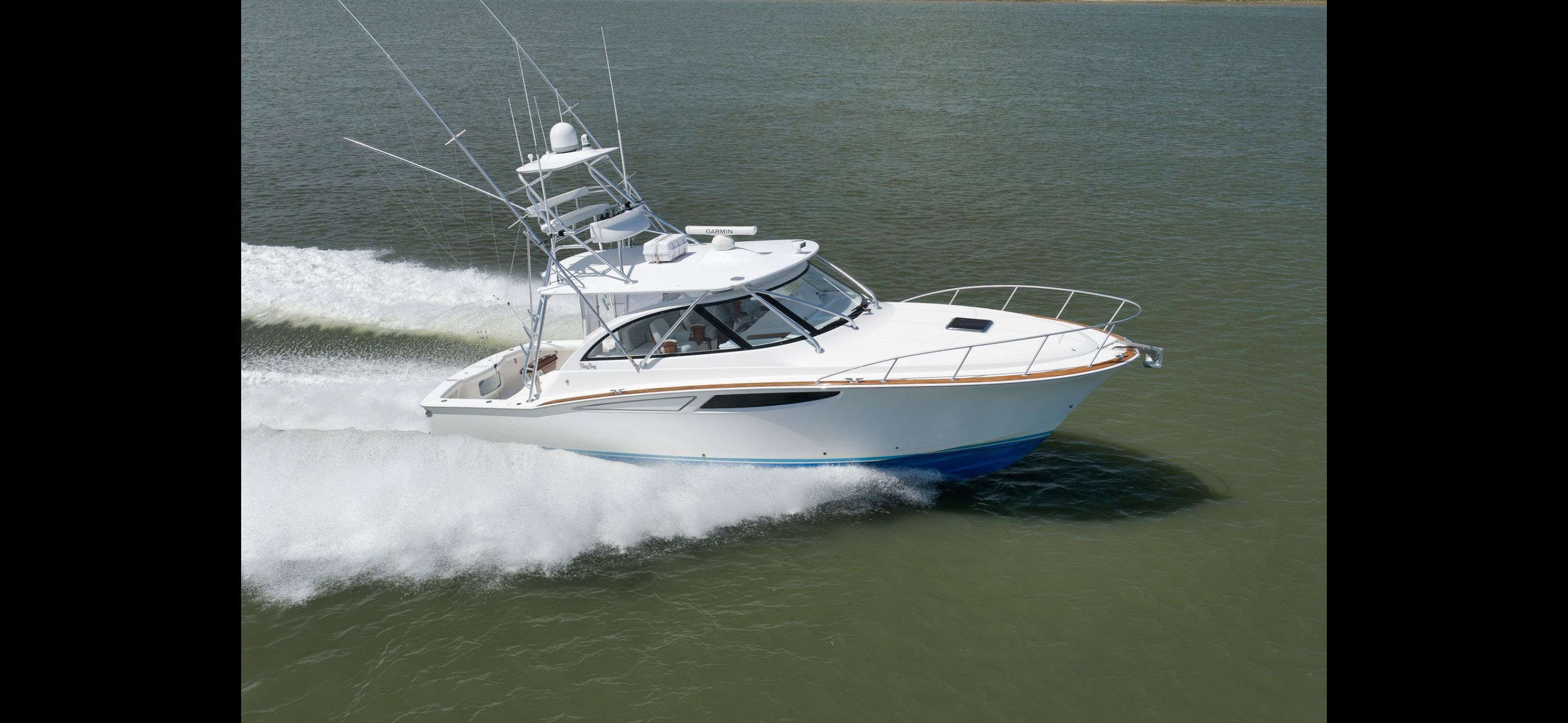 Mag Bay 42 Express 2022 cruising swiftly on water.