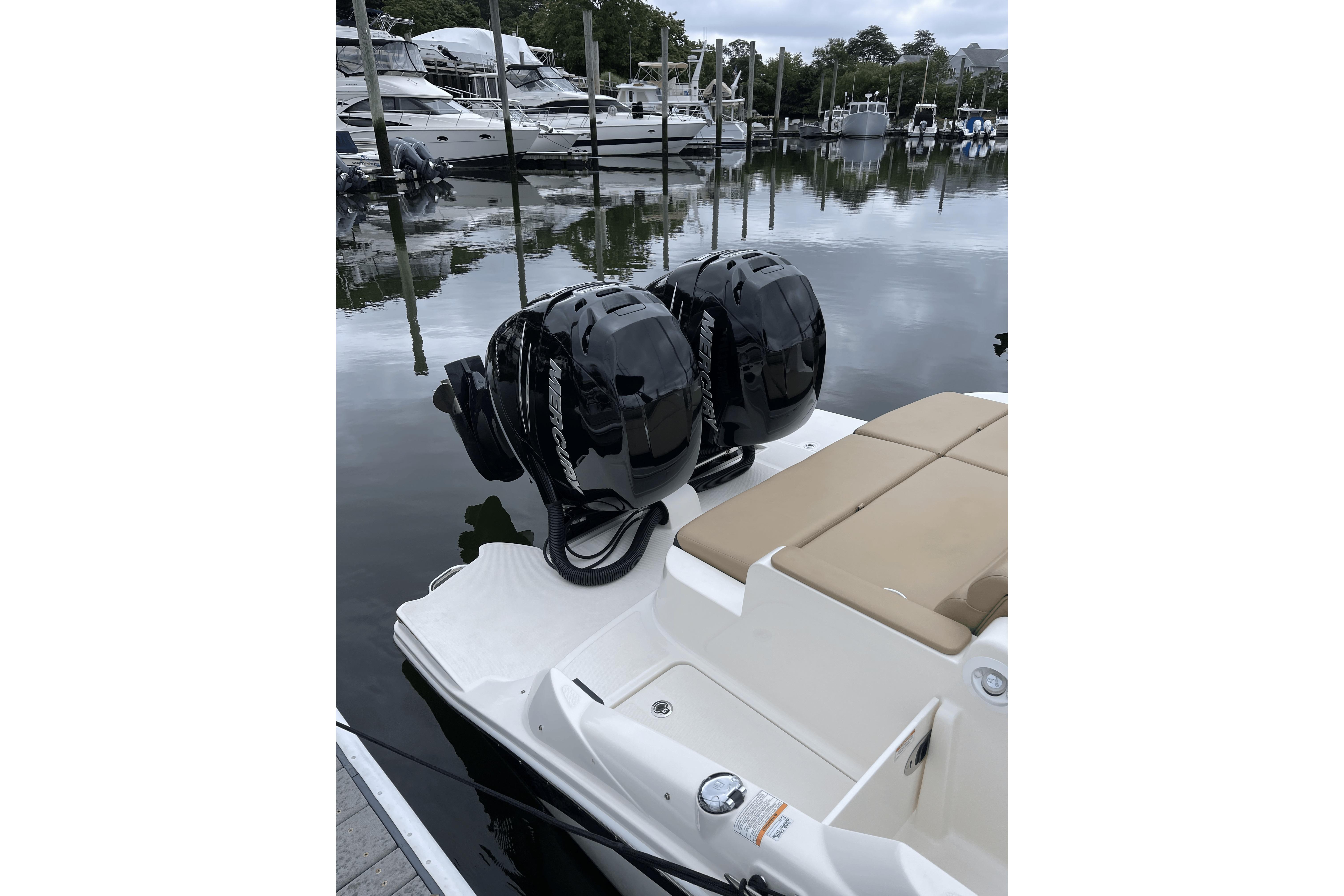 2018 Sea Ray SDX 290 Outboard with dual Mercury engines docked at marina.