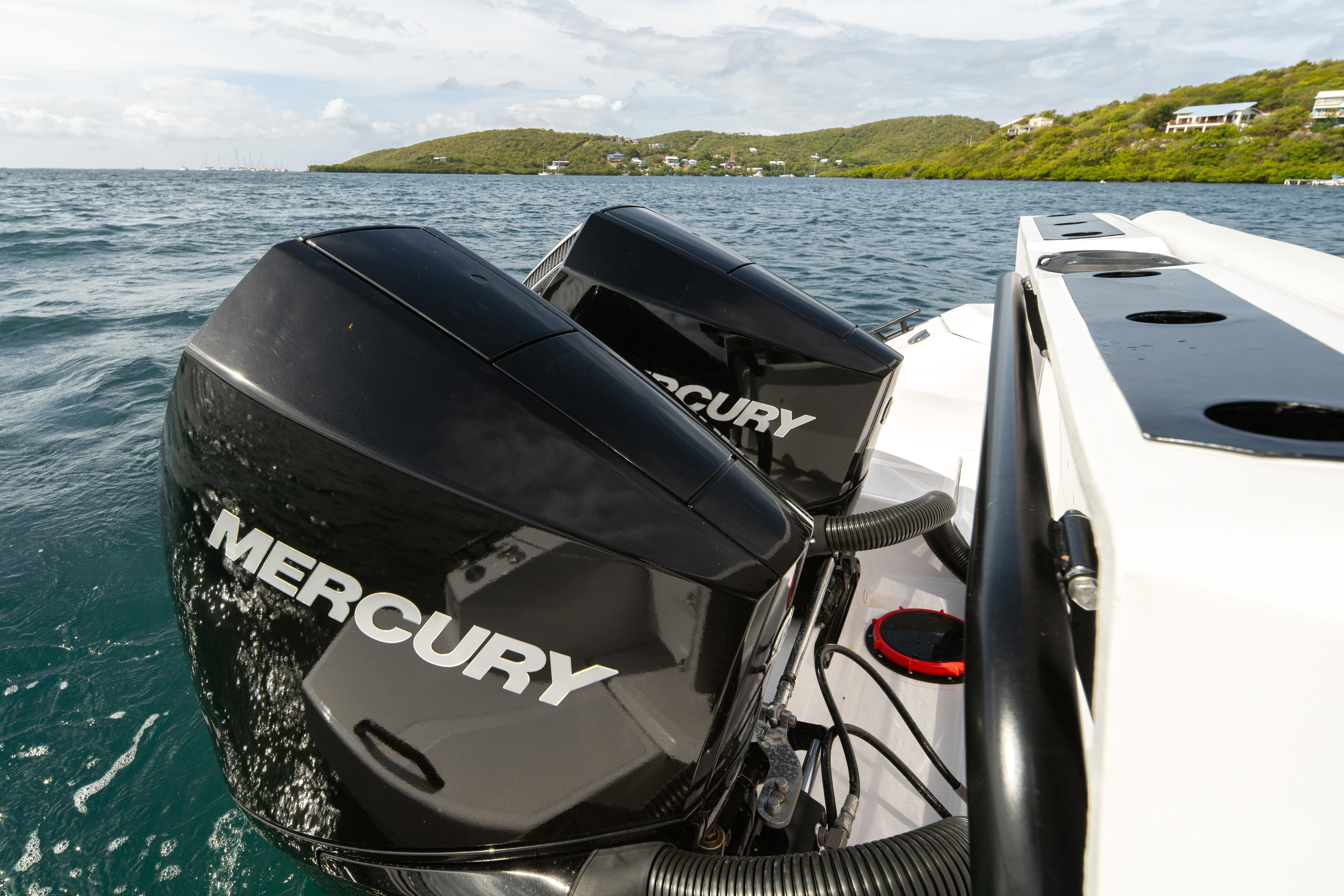 2025 Axopar 29 CCX with dual Mercury outboard engines on open water.