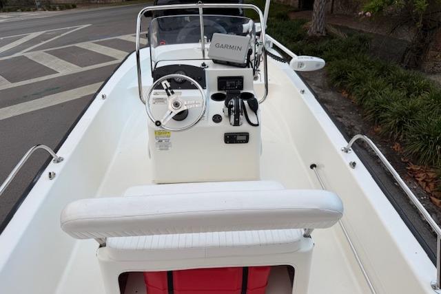 2016 Boston Whaler 150 Montauk boat interior with Garmin navigation system and steering console.