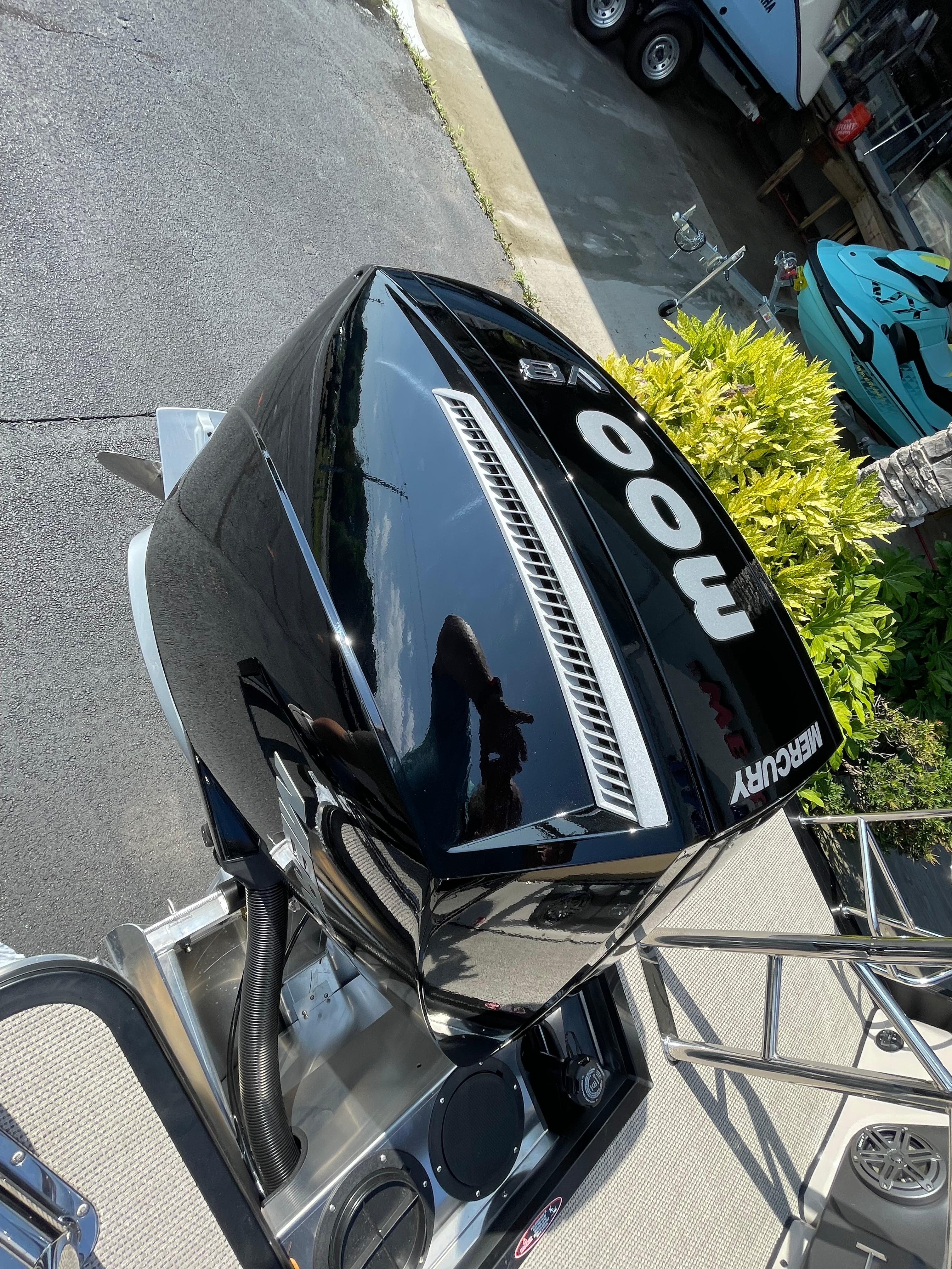 2026 Harris Solstice 230 with Mercury 400 outboard engine, parked on a sunny day.