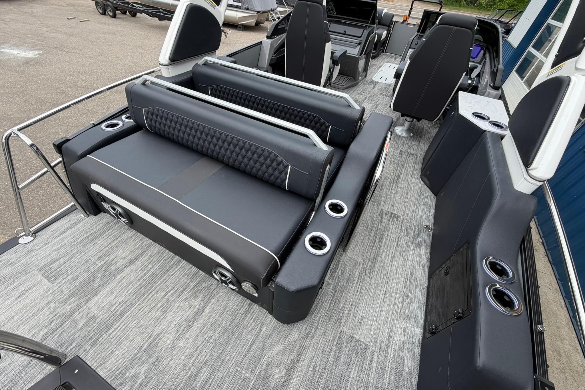 2026 Avalon Excalibur LTD Flex Lounge boat interior with luxurious seating and cup holders.