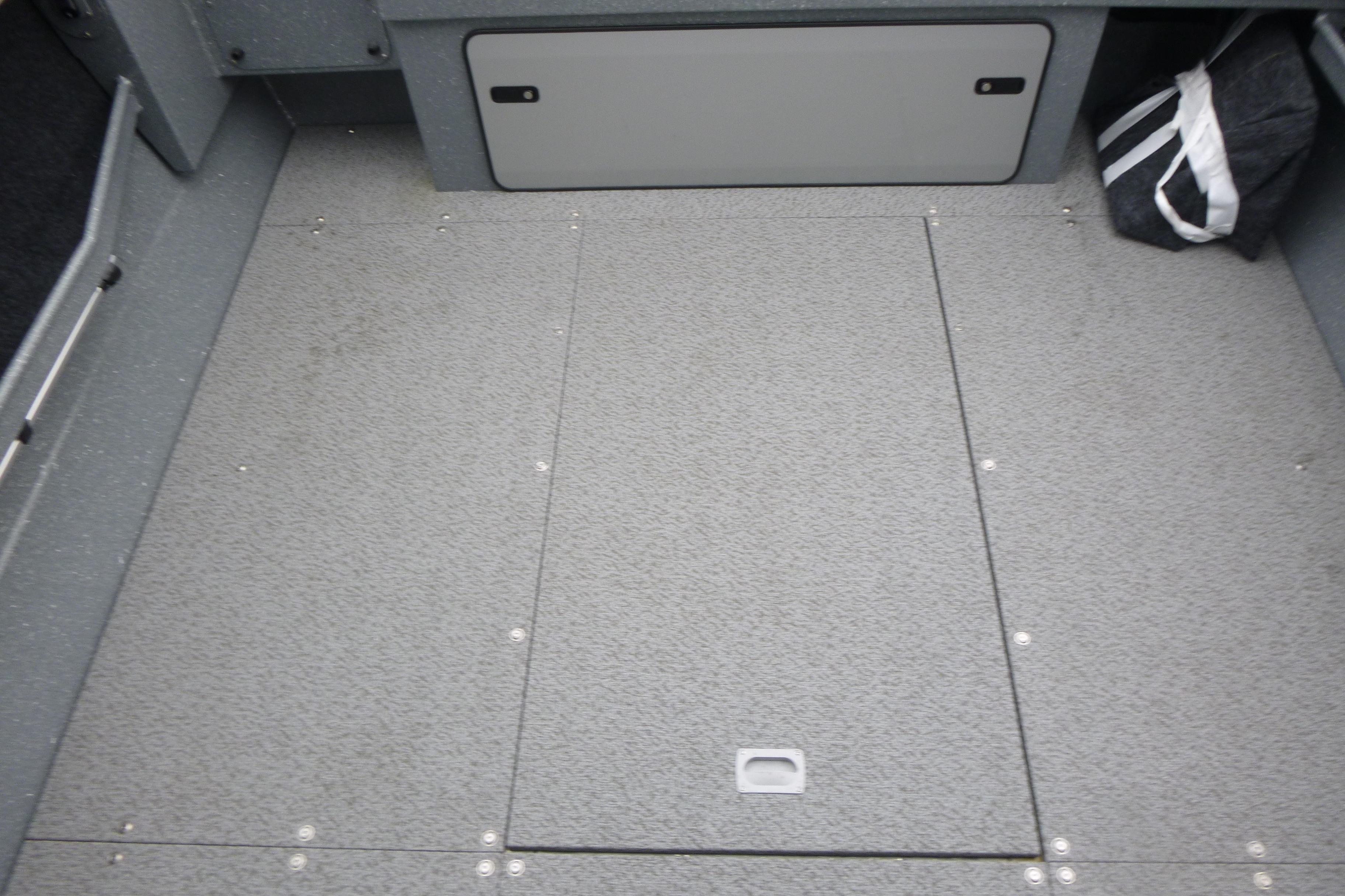 Interior of 2026 KingFisher 2025 Escape boat with gray textured flooring.