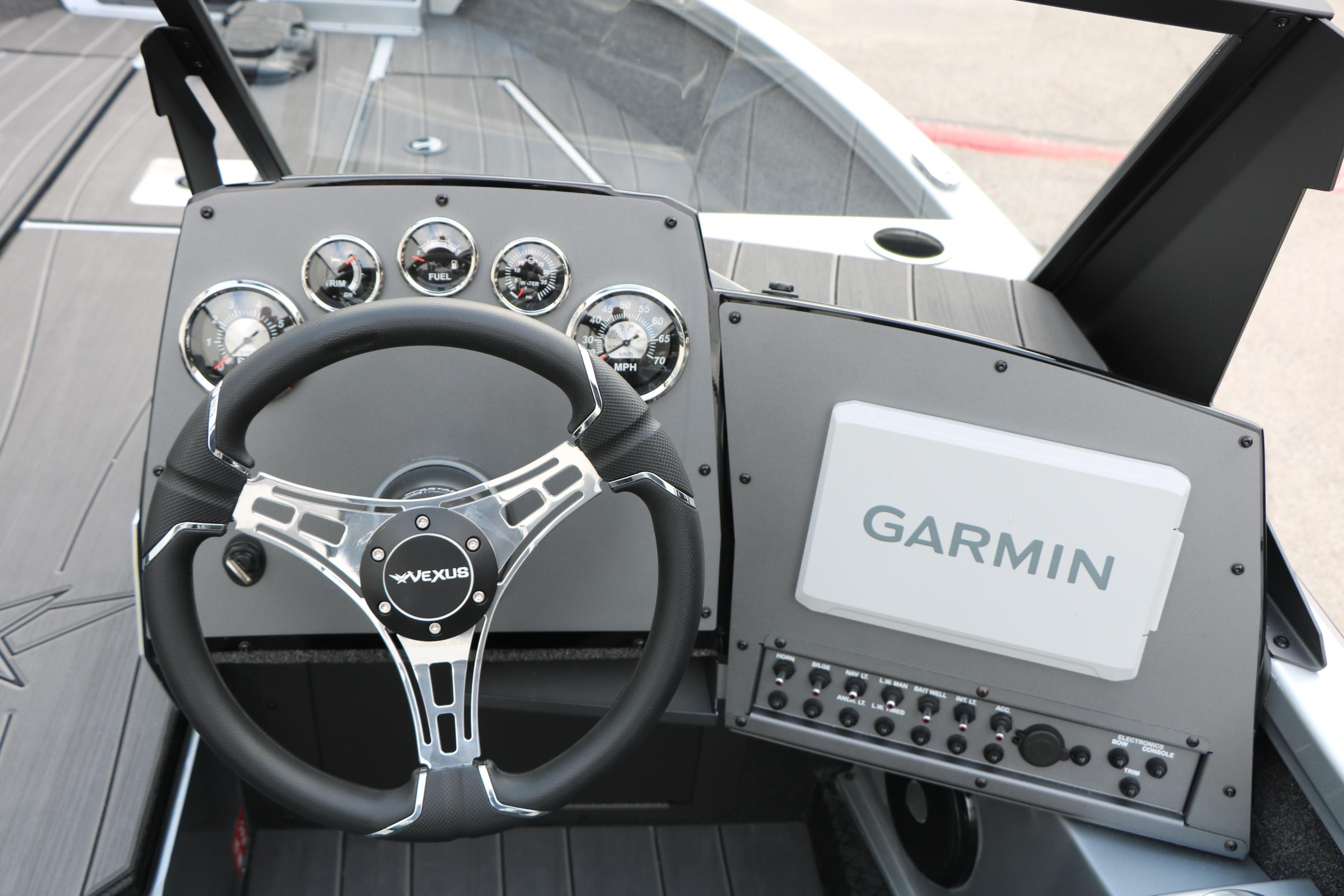 Steering console of 2026 Vexus ADX 190 boat with Garmin navigation system.
