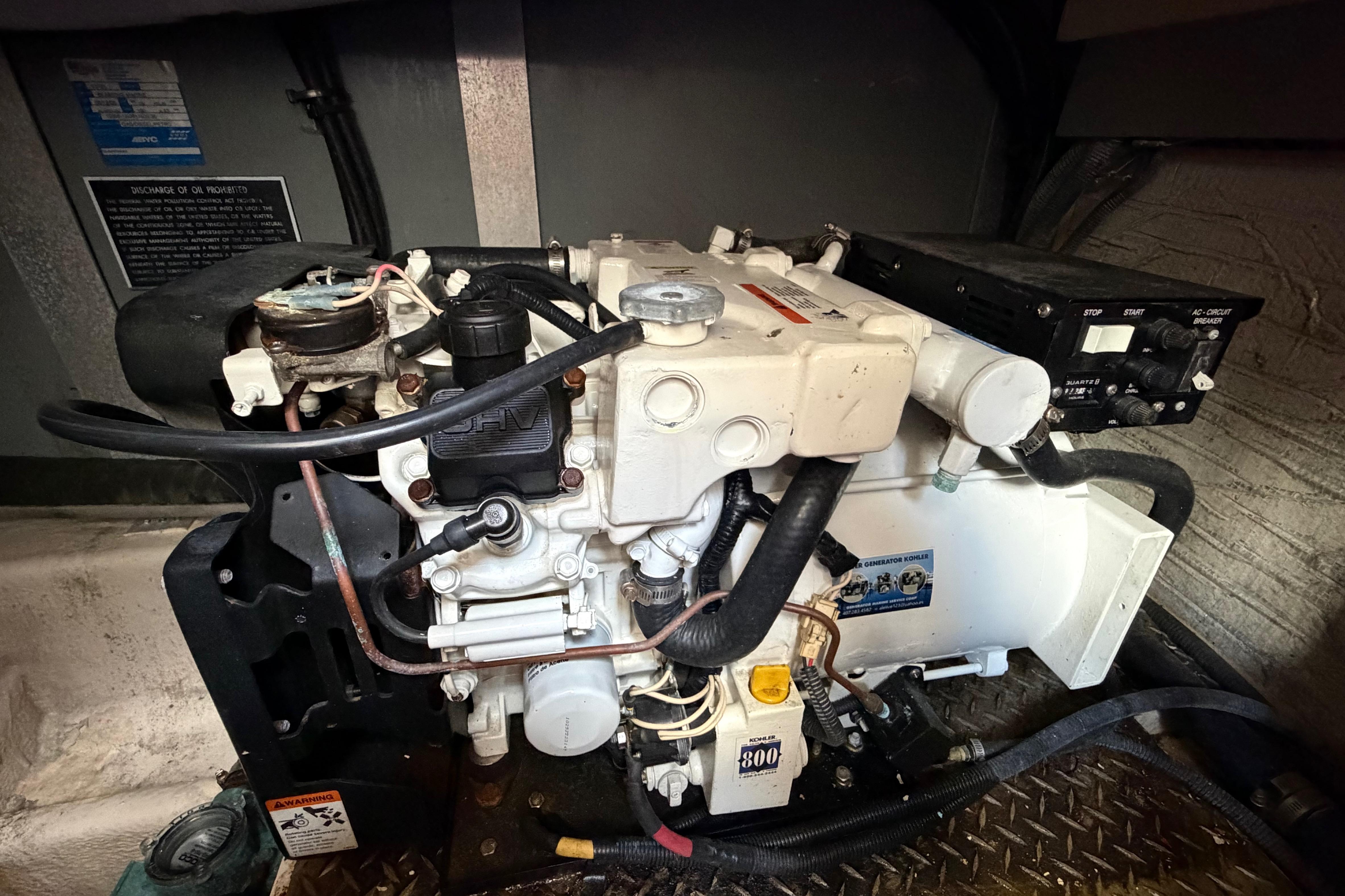 Engine compartment of a 2007 Monterey 350 Sport Yacht, showcasing mechanical components and wiring.