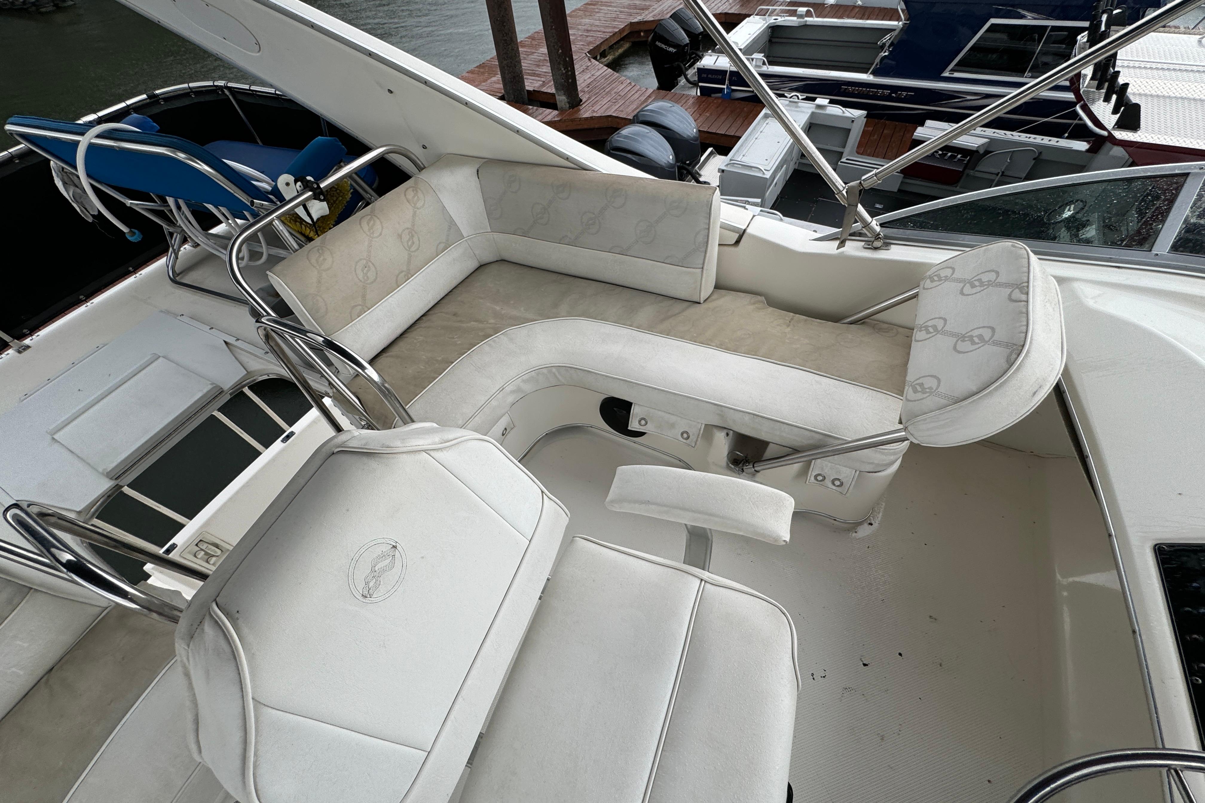 1996 Bayliner 3388 Command Bridge Motoryacht interior with white seating and helm.