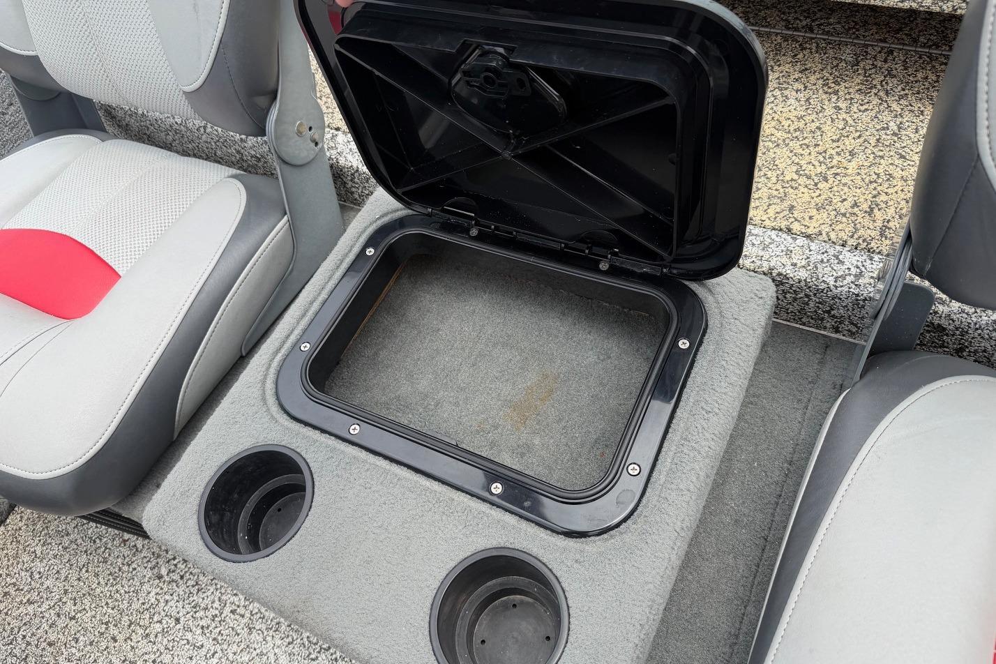 2016 Tracker Pro Team 175 TXW boat interior with open storage compartment and cup holders.