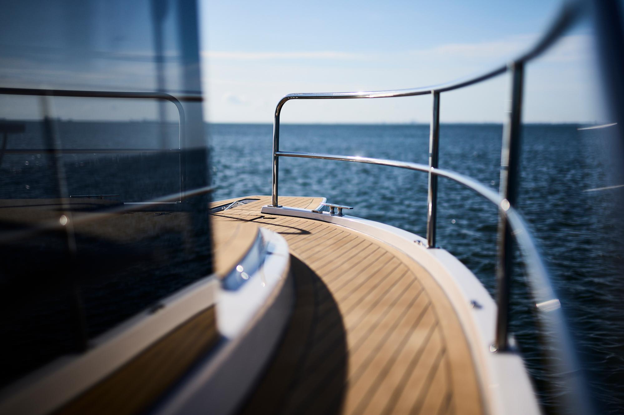 Sleek Northman 1050 yacht deck overlooking serene ocean, 2025 model.