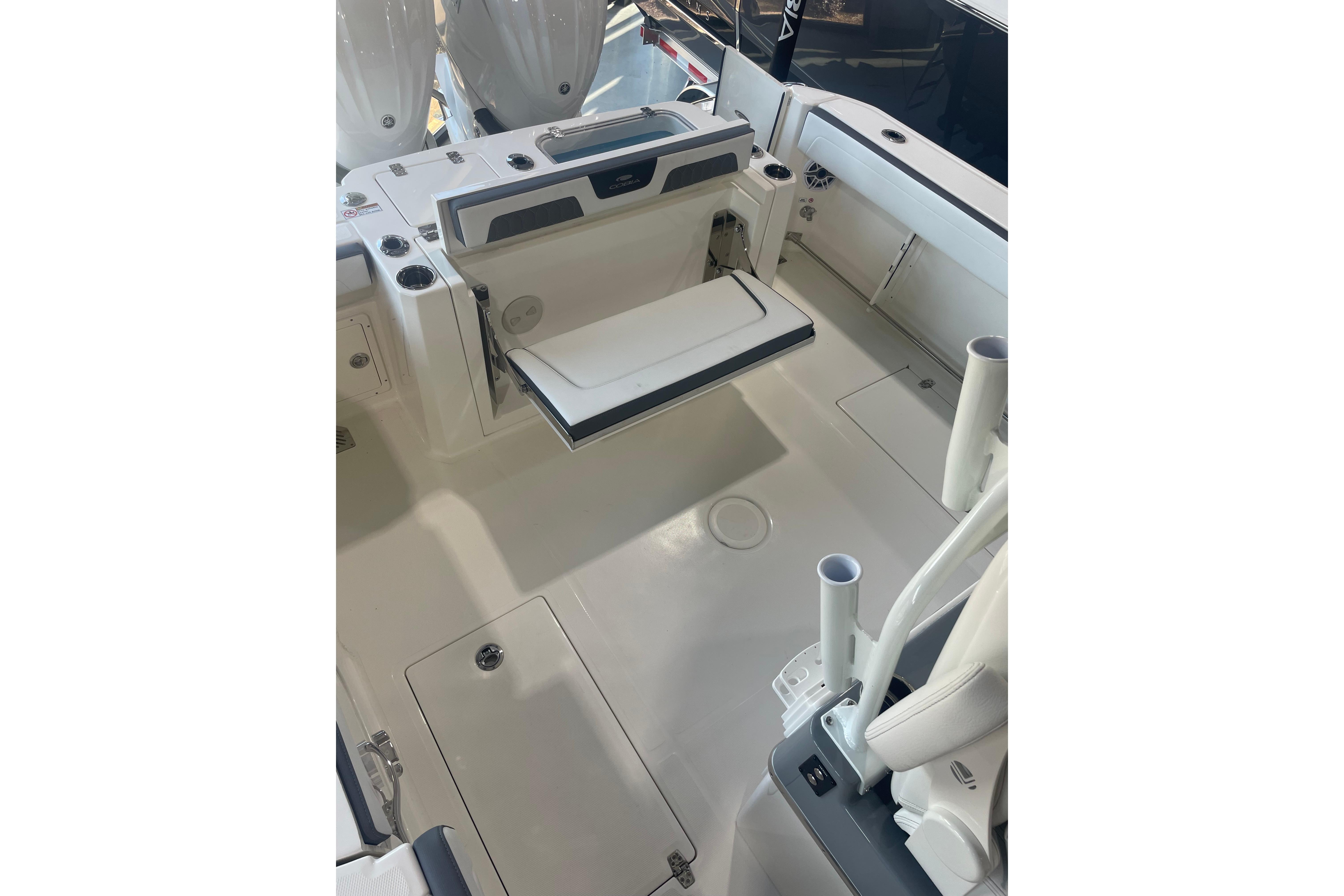 2026 Cobia 285 Open Center Console boat interior with seating and storage features.