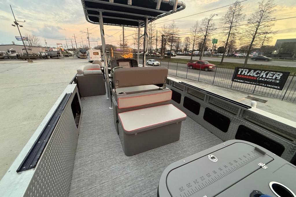 2022 Apex Marine 8524 Pro Fish N Cruise pontoon boat interior at sunset.