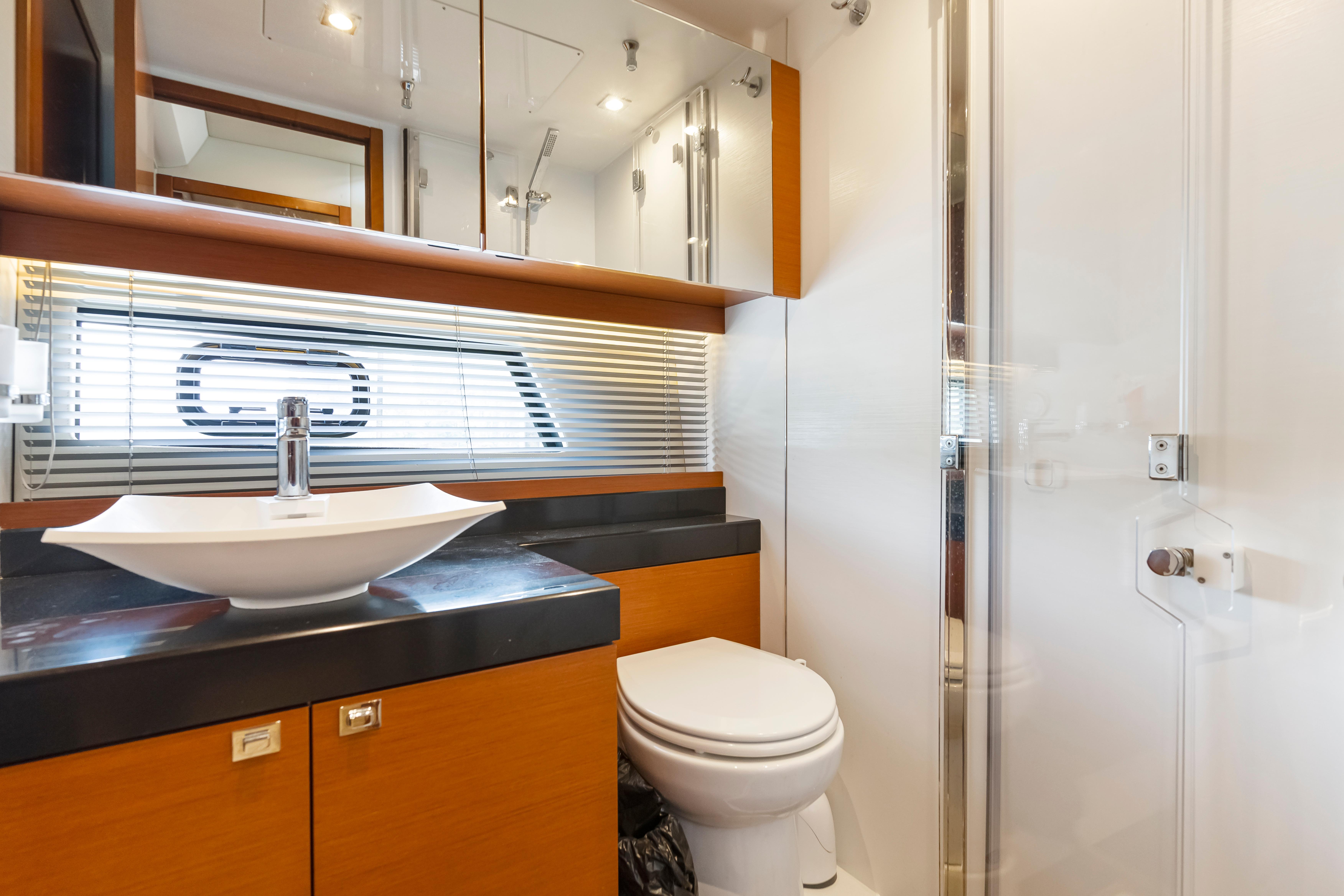 Luxurious bathroom interior of 2017 Prestige 500 yacht with modern fixtures and elegant design.