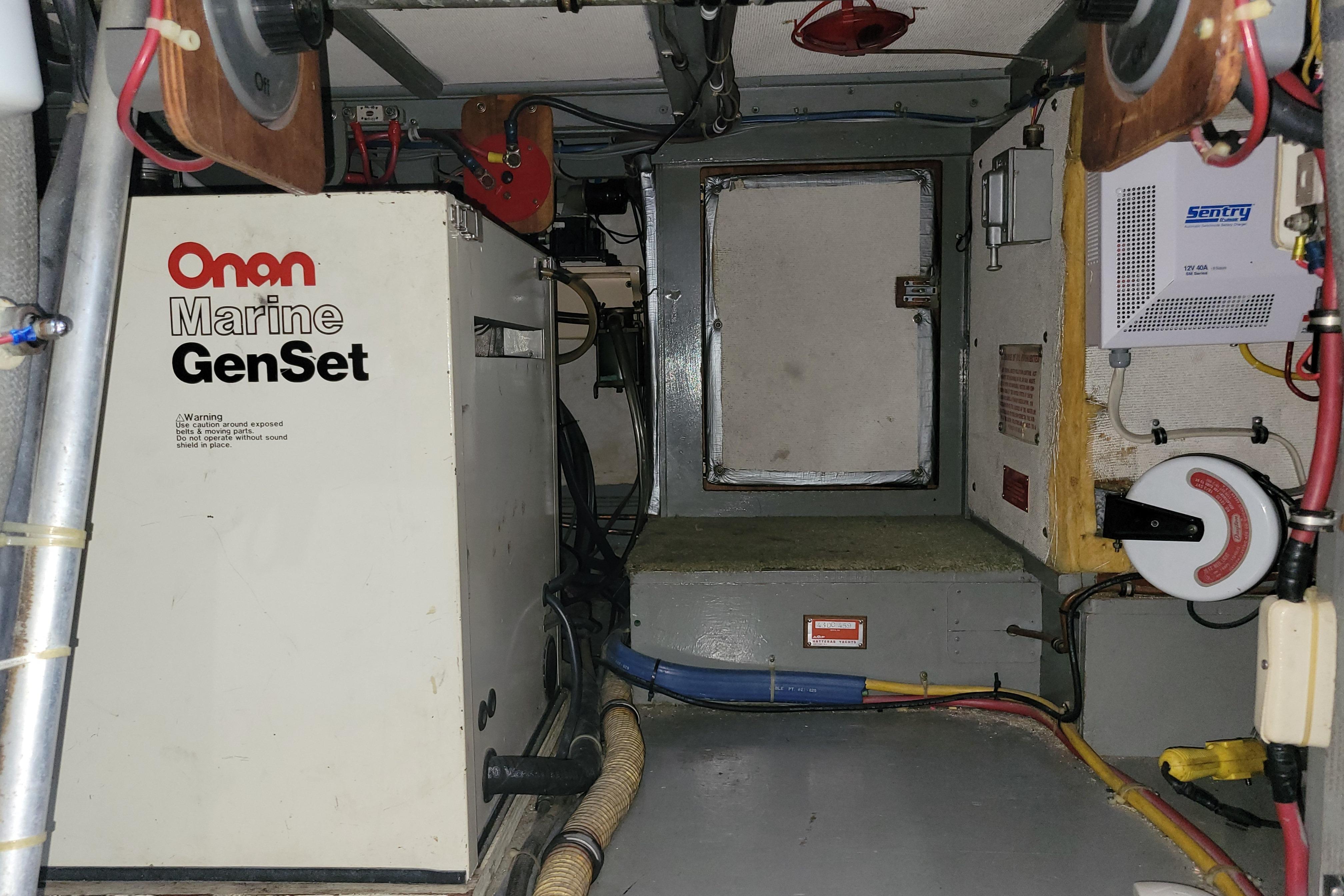 Engine room of 1977 Hatteras 43 Double Cabin with Onan Marine GenSet.