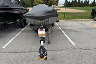 2020 Tracker Pro 170 boat covered and parked in a lot.