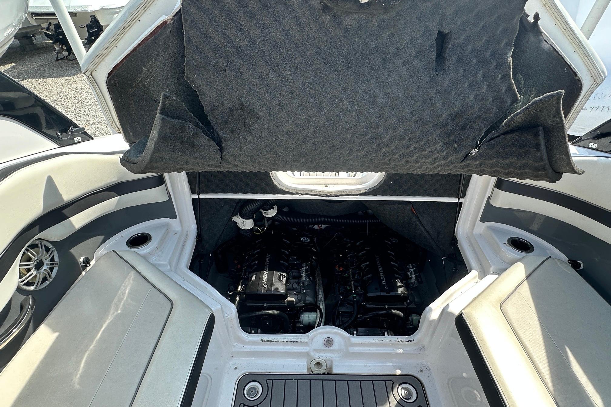 Open engine compartment of a 2016 Yamaha 242 Limited S boat.