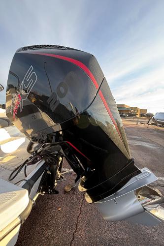 2024 Tahoe T21 outboard motor with sleek black and red design.