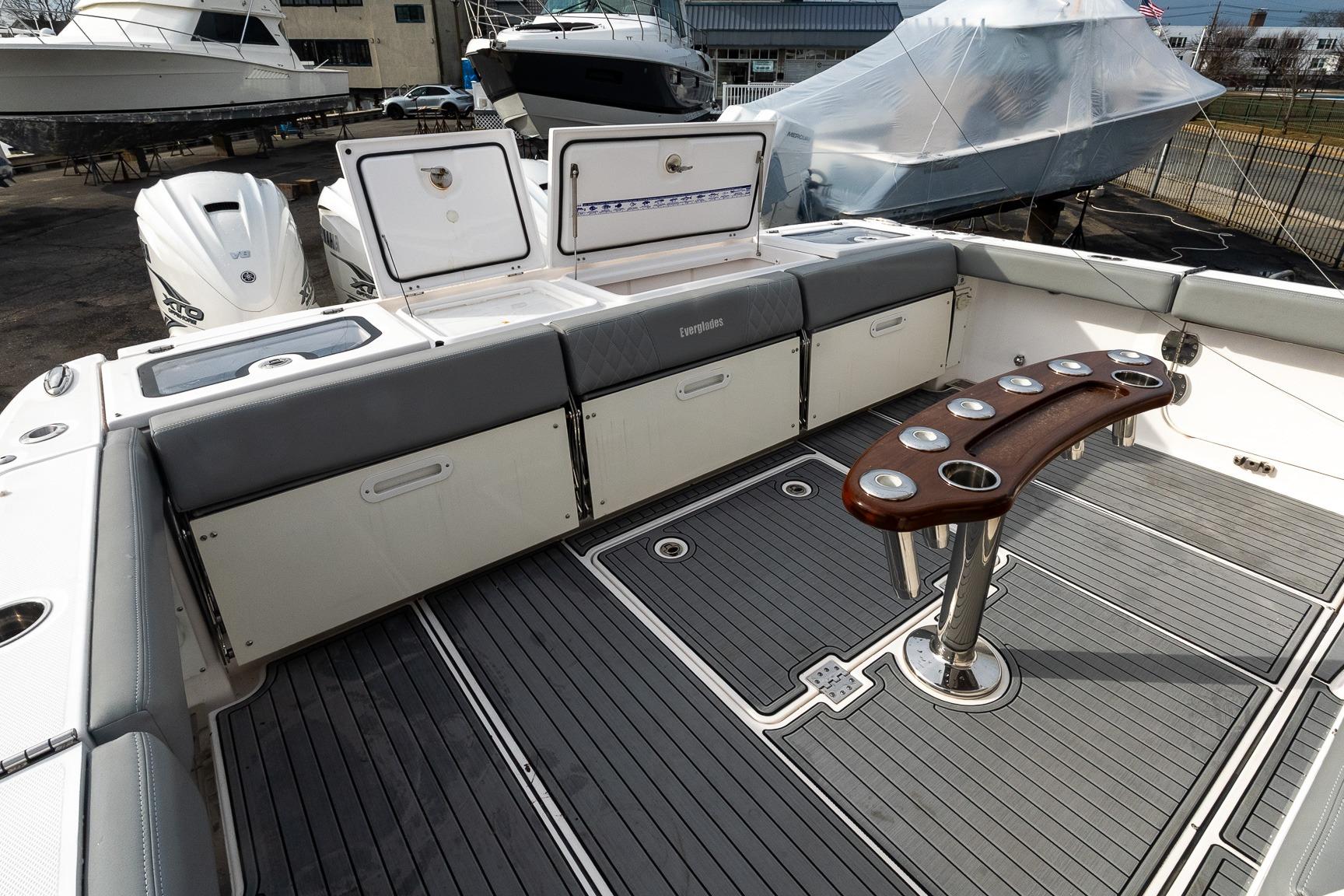 2023 Everglades 455 Center Console boat interior with seating and rod holders.