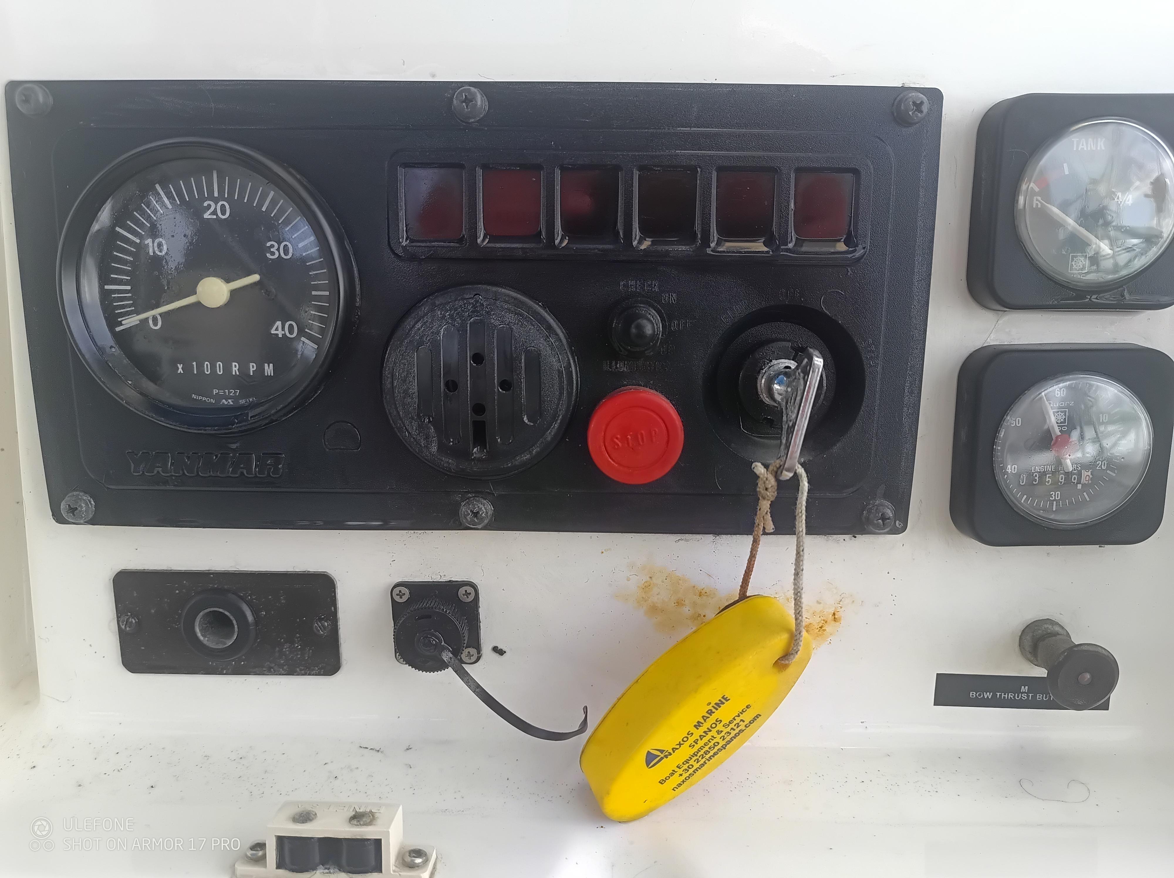 Control panel of a 1992 Jeanneau Sun Odyssey 42 sailboat with gauges and switches.