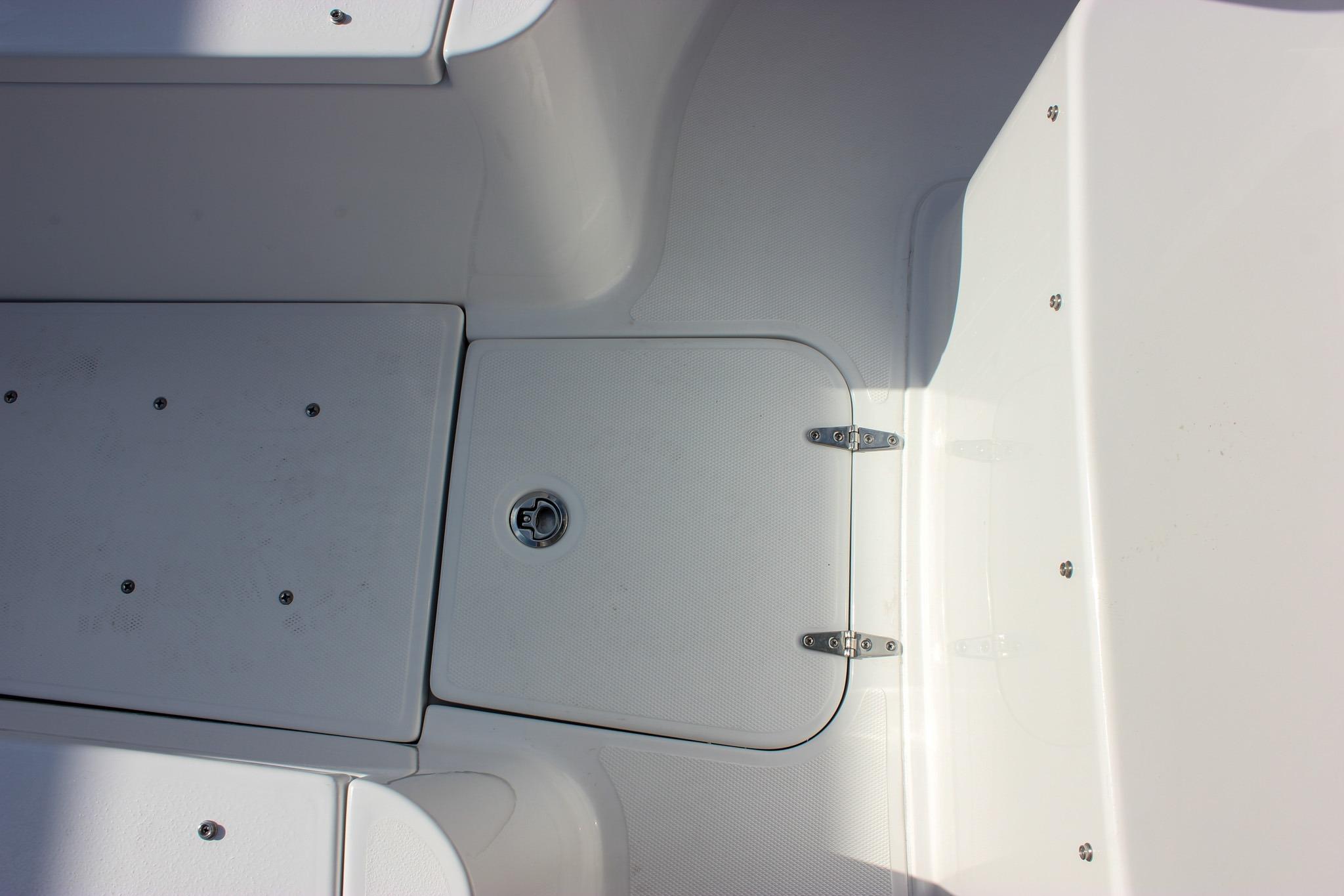 2027 Sea Hunt Ultra 275 SE boat deck with storage compartment and latch.