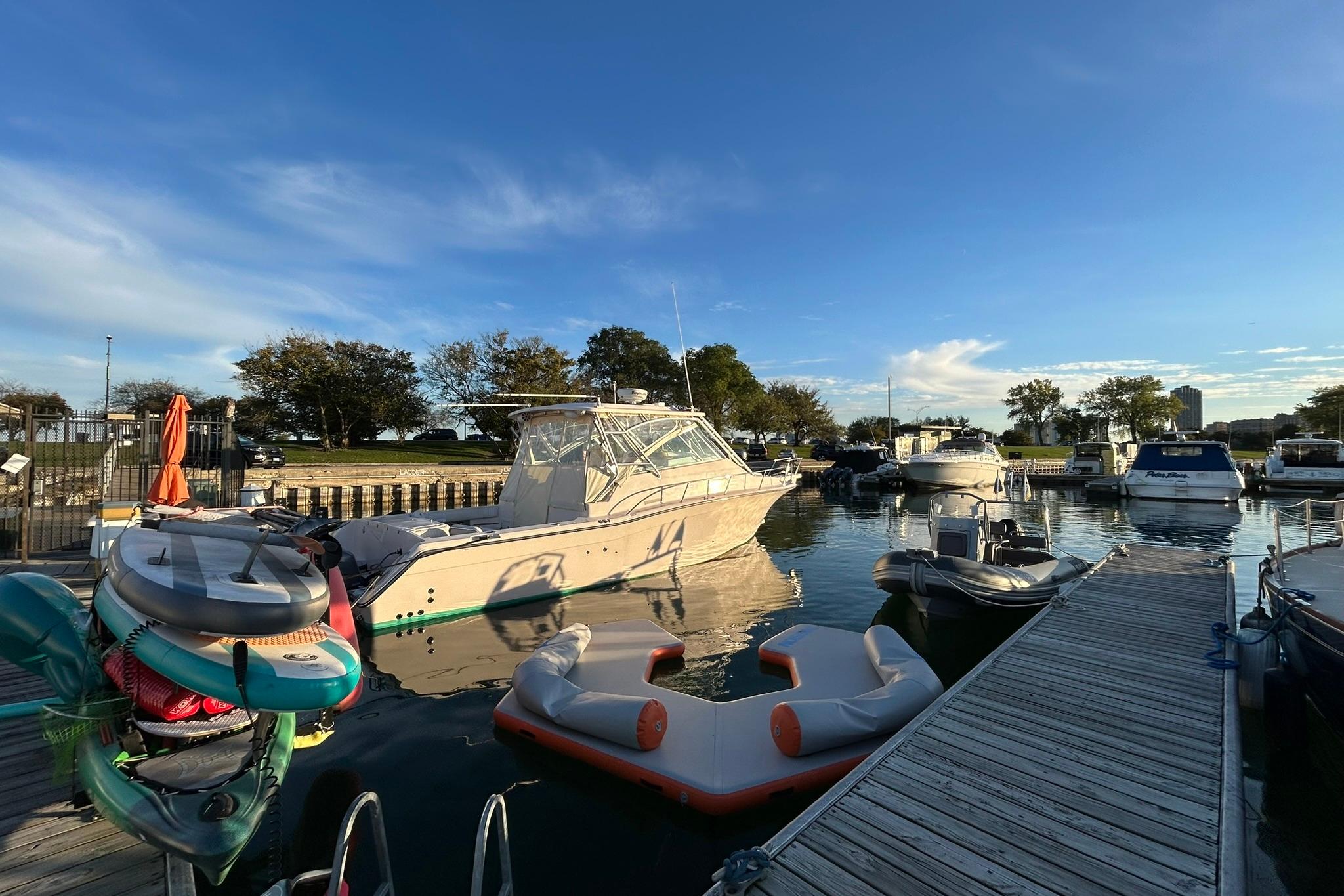 2007 Grady-White Express 360 docked at a marina under a clear blue sky.