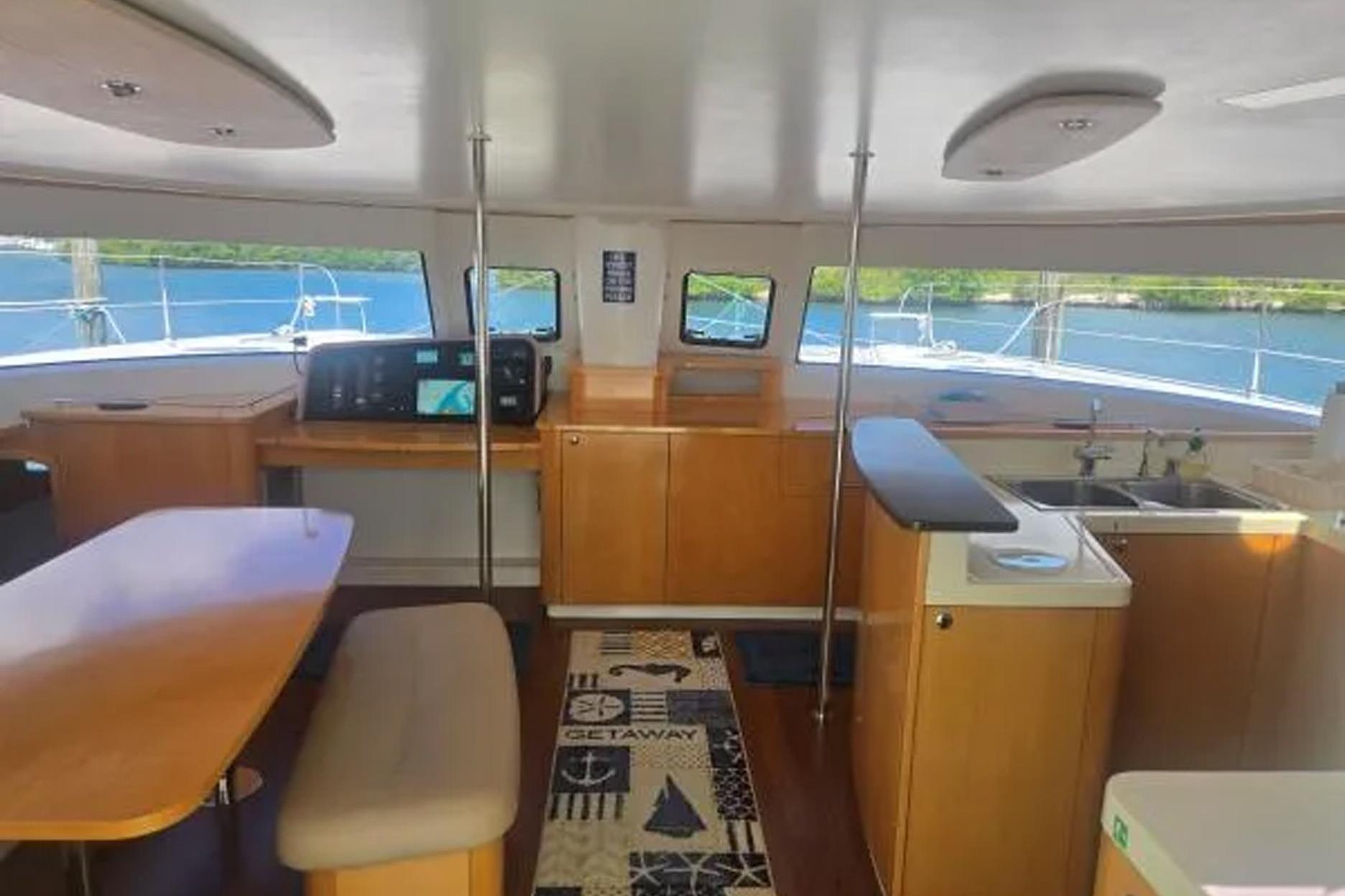 Interior of 2008 Fountaine Pajot Salina 48 catamaran with modern kitchen and dining area.