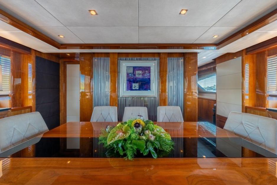 Luxurious dining area on 2009 Sunseeker 34 Metre Yacht with elegant wood finish.
