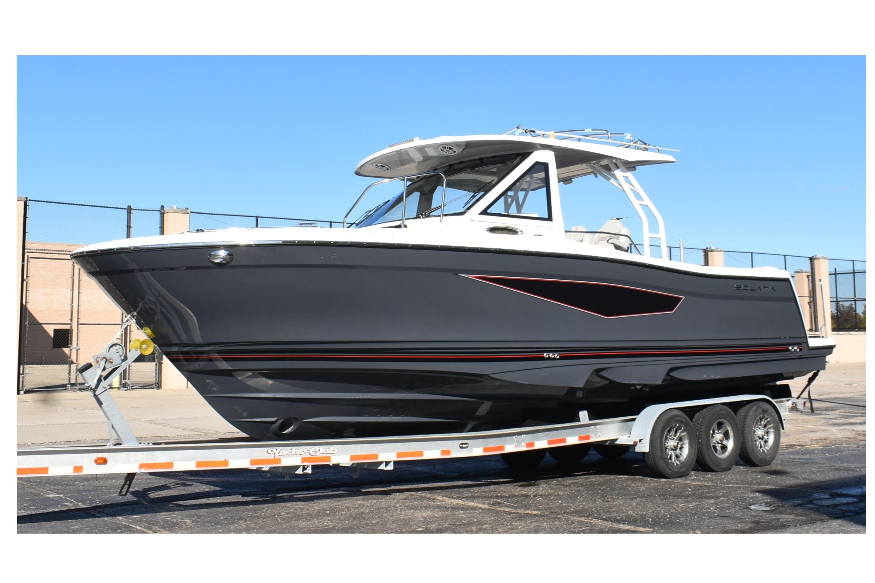 2025 Solara S-310 CW boat on trailer, sleek design, parked outdoors.
