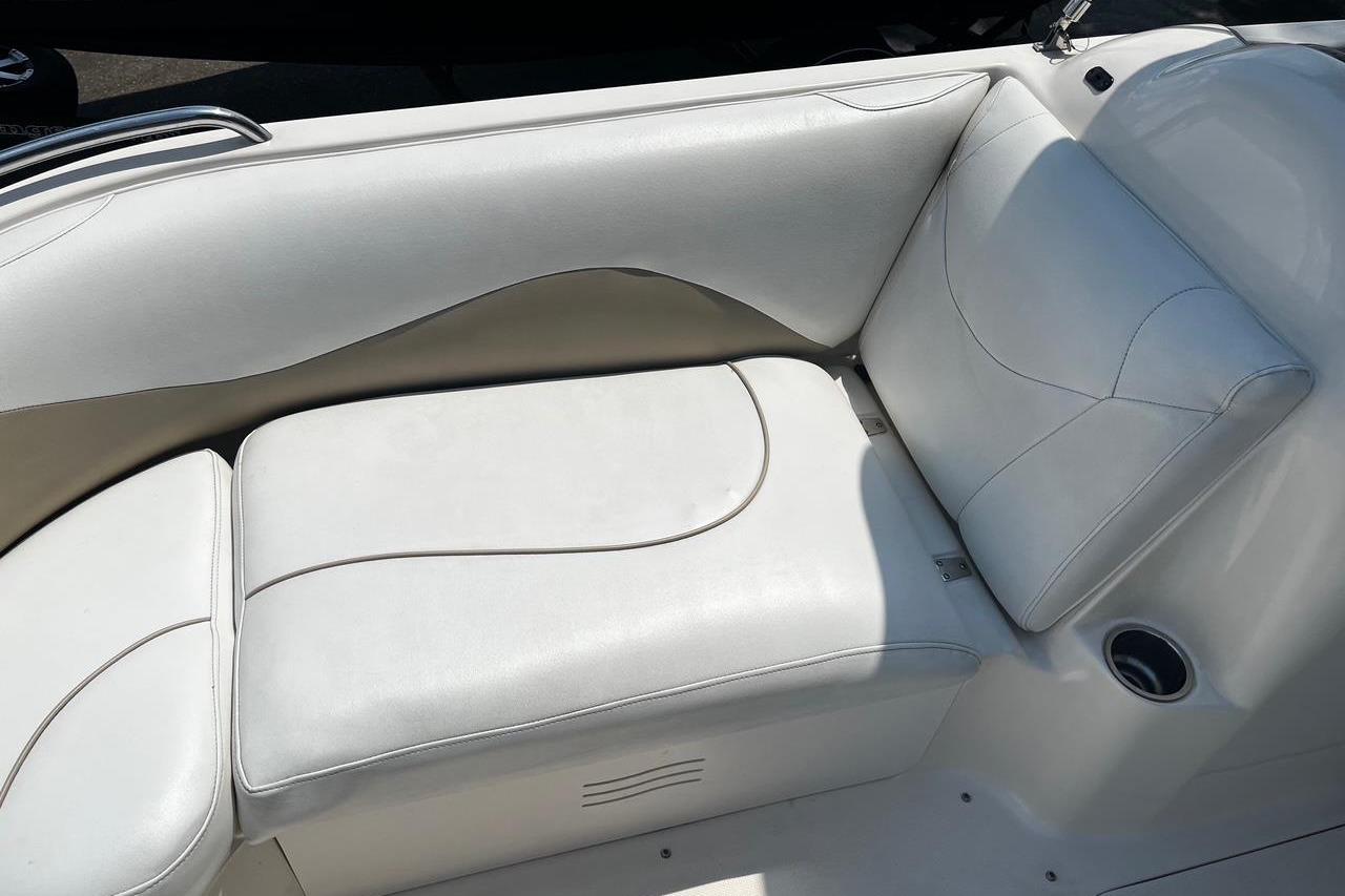 White leather seating on a 2008 Hurricane FD202 boat, featuring sleek design and comfort.