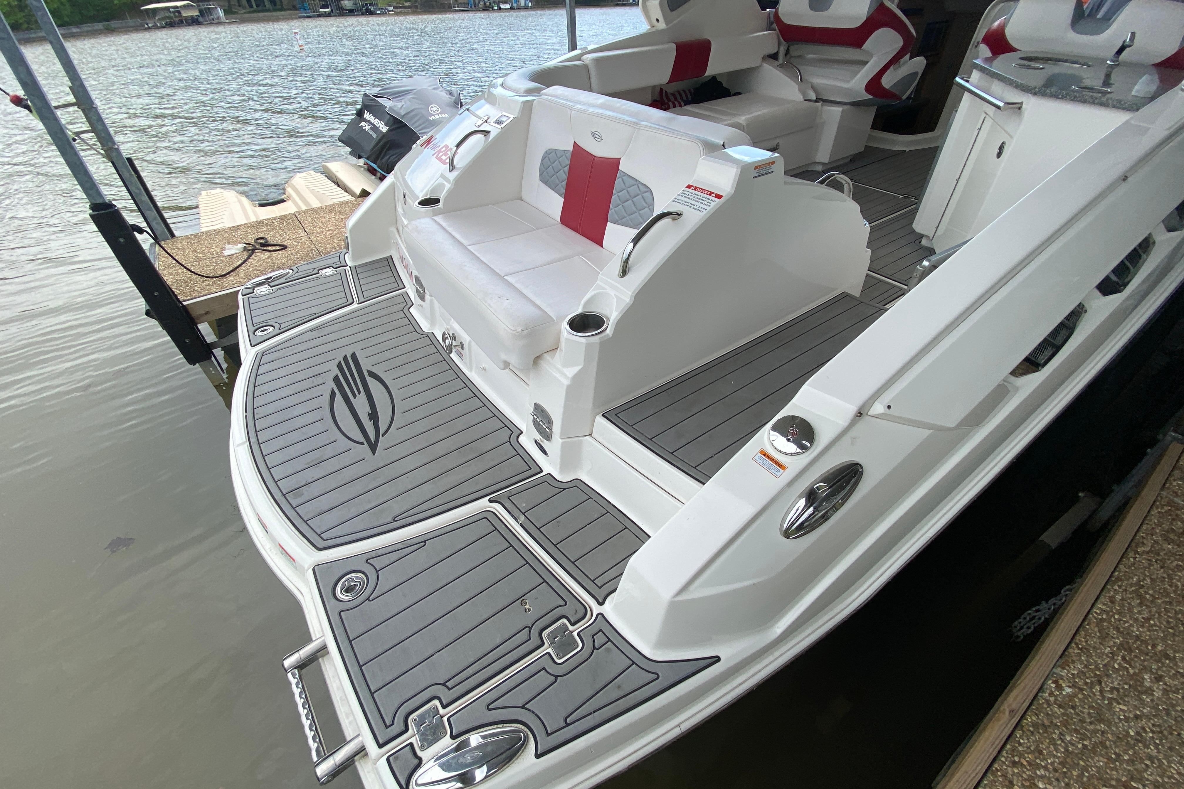 2012 Chaparral 327 SSX boat with sleek deck design and comfortable seating.