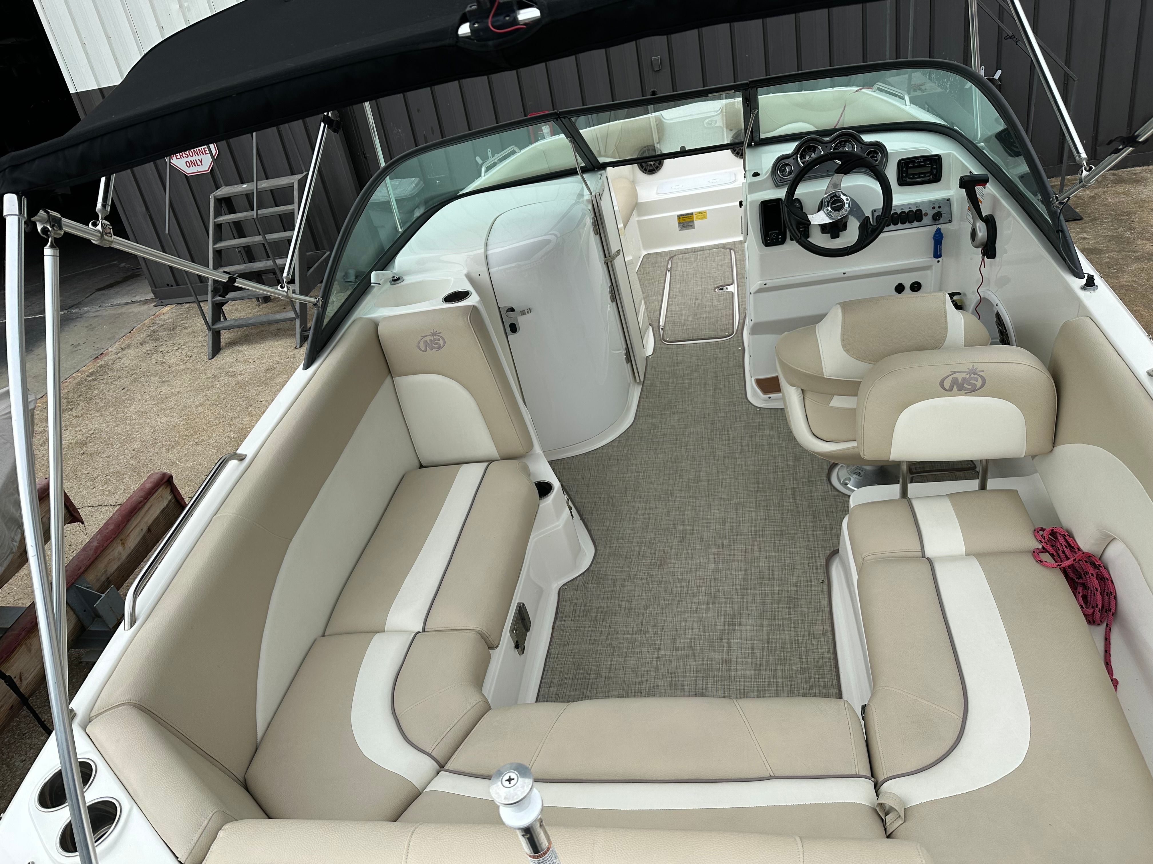Interior view of a 2018 NauticStar 223DC Sport Deck boat.