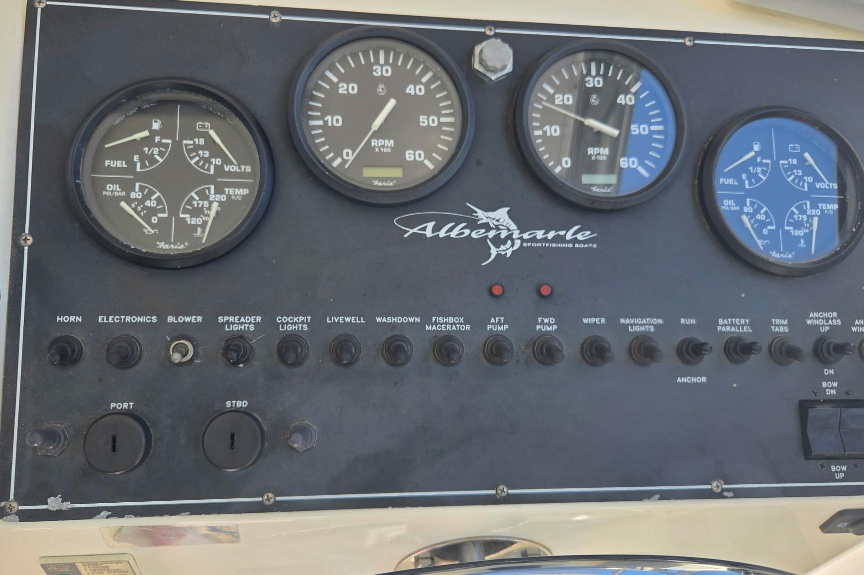 Instrument panel of a 2000 Albemarle 280 Express Fisherman boat with gauges and switches.