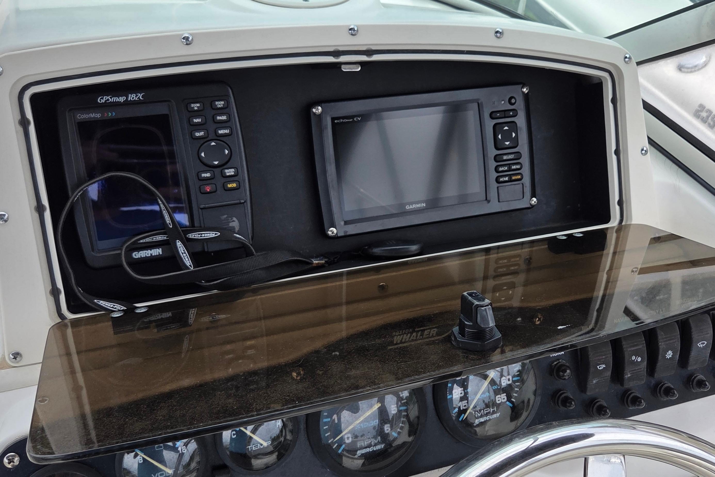Dashboard of a 2000 Boston Whaler 21 Ventura with Garmin GPS devices.
