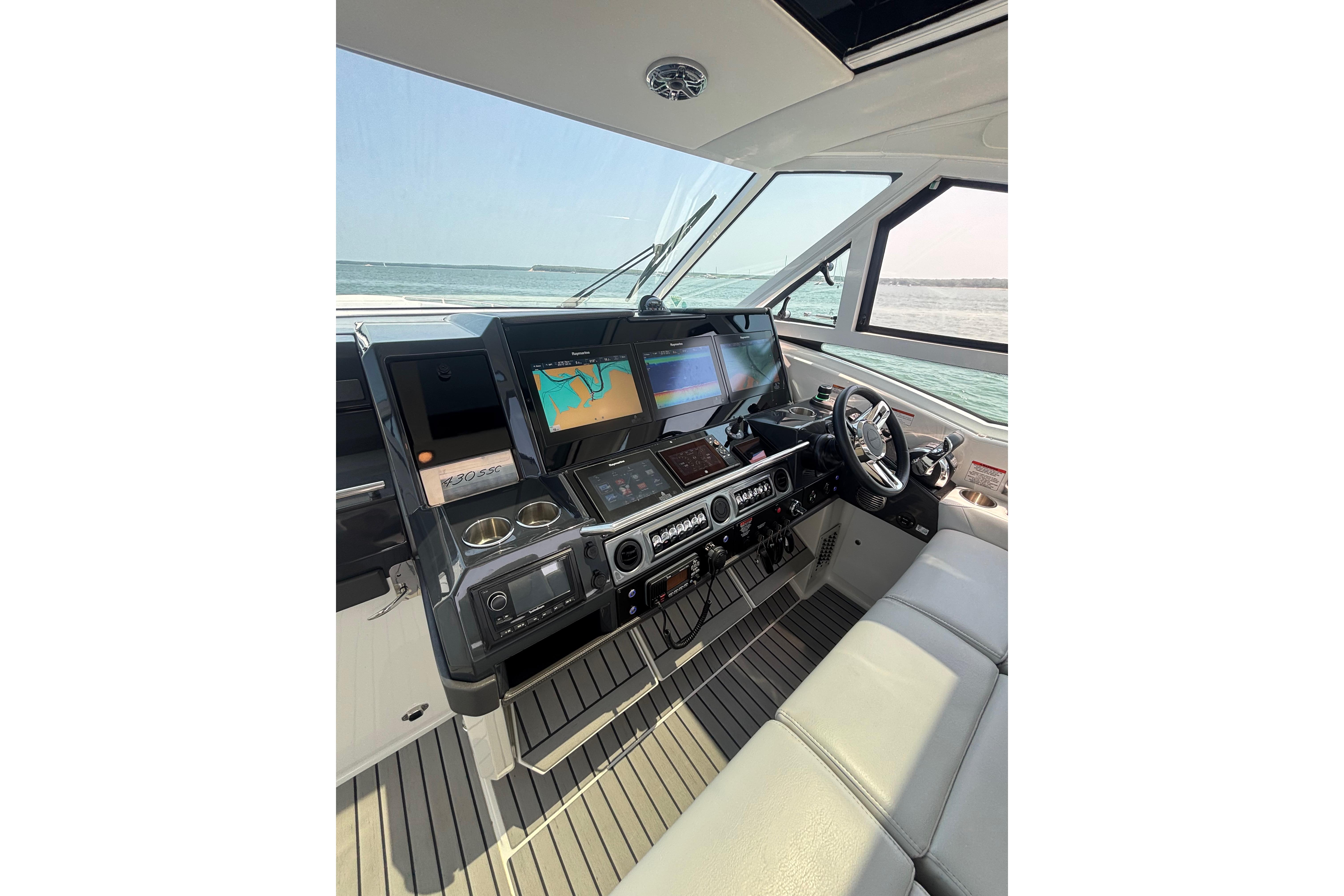 2019 Formula 430 Super Sport Crossover helm with advanced navigation displays and luxurious seating.