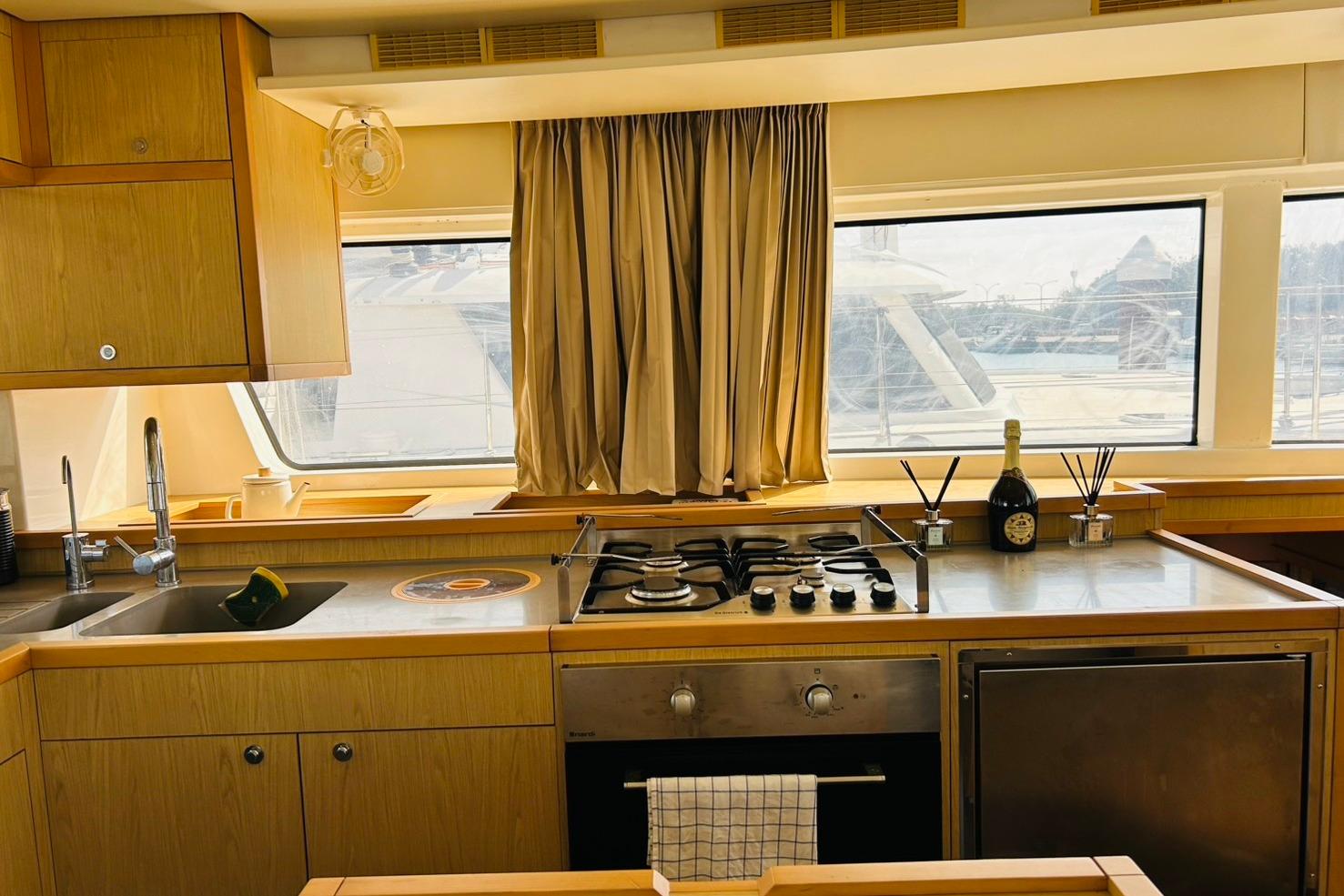 Luxurious kitchen interior of 2013 Lagoon 52F yacht with modern appliances and elegant design.