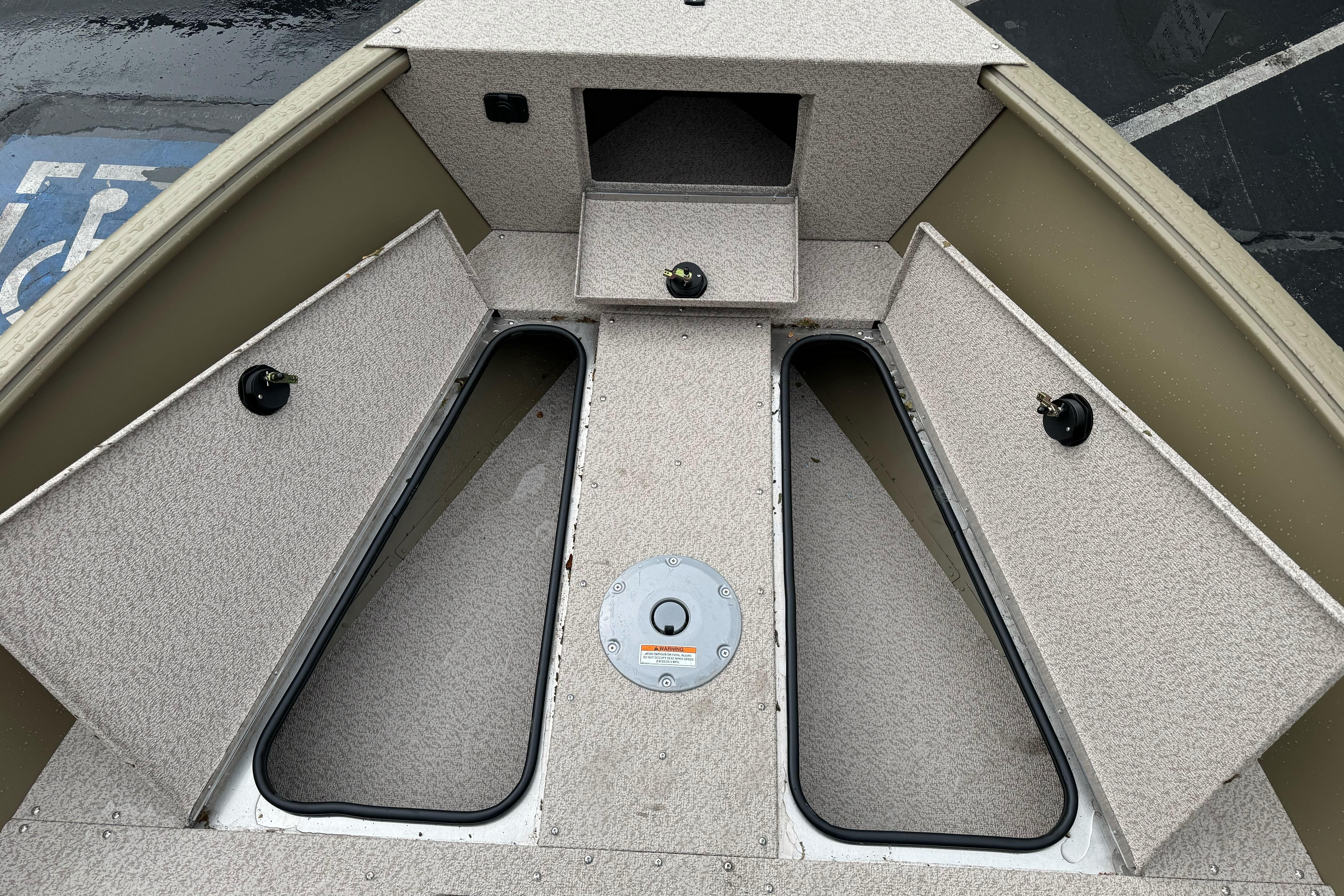 2026 Lund 2075 Alaskan SS boat interior with open storage compartments.