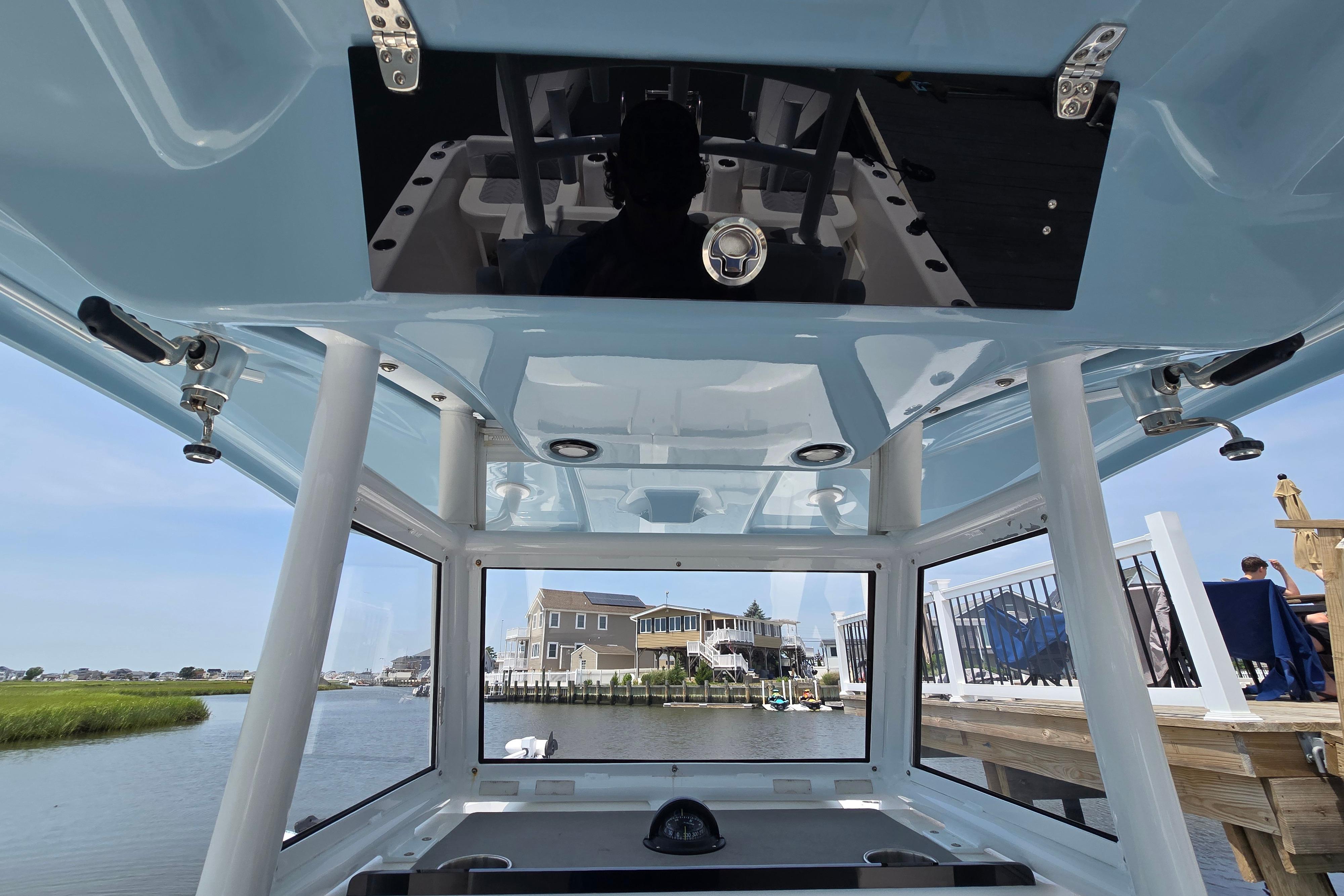 2021 Twin Vee 280 GFX CC boat interior with waterfront view.