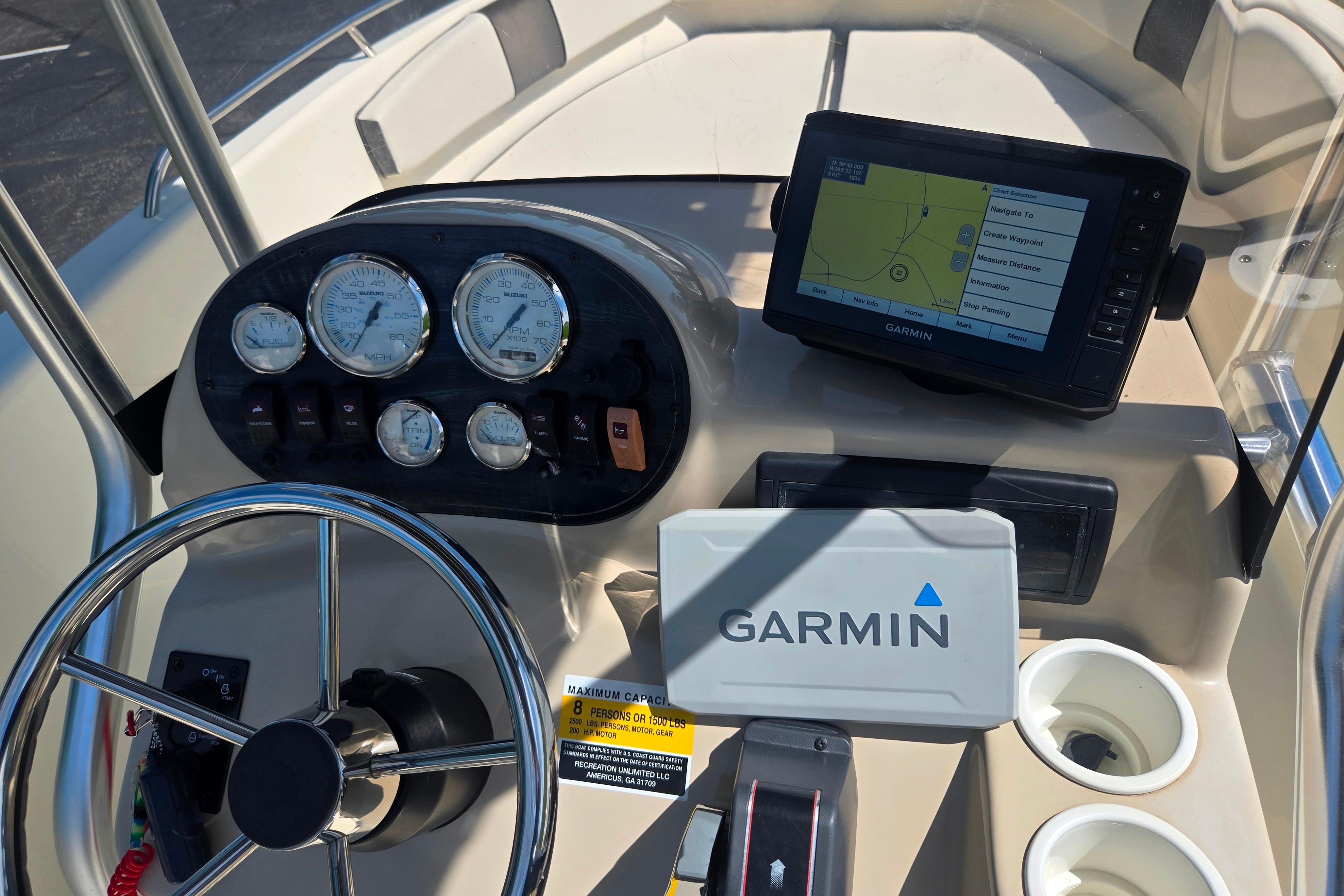 2016 Key Largo 2000CC boat dashboard with Garmin GPS and gauges.