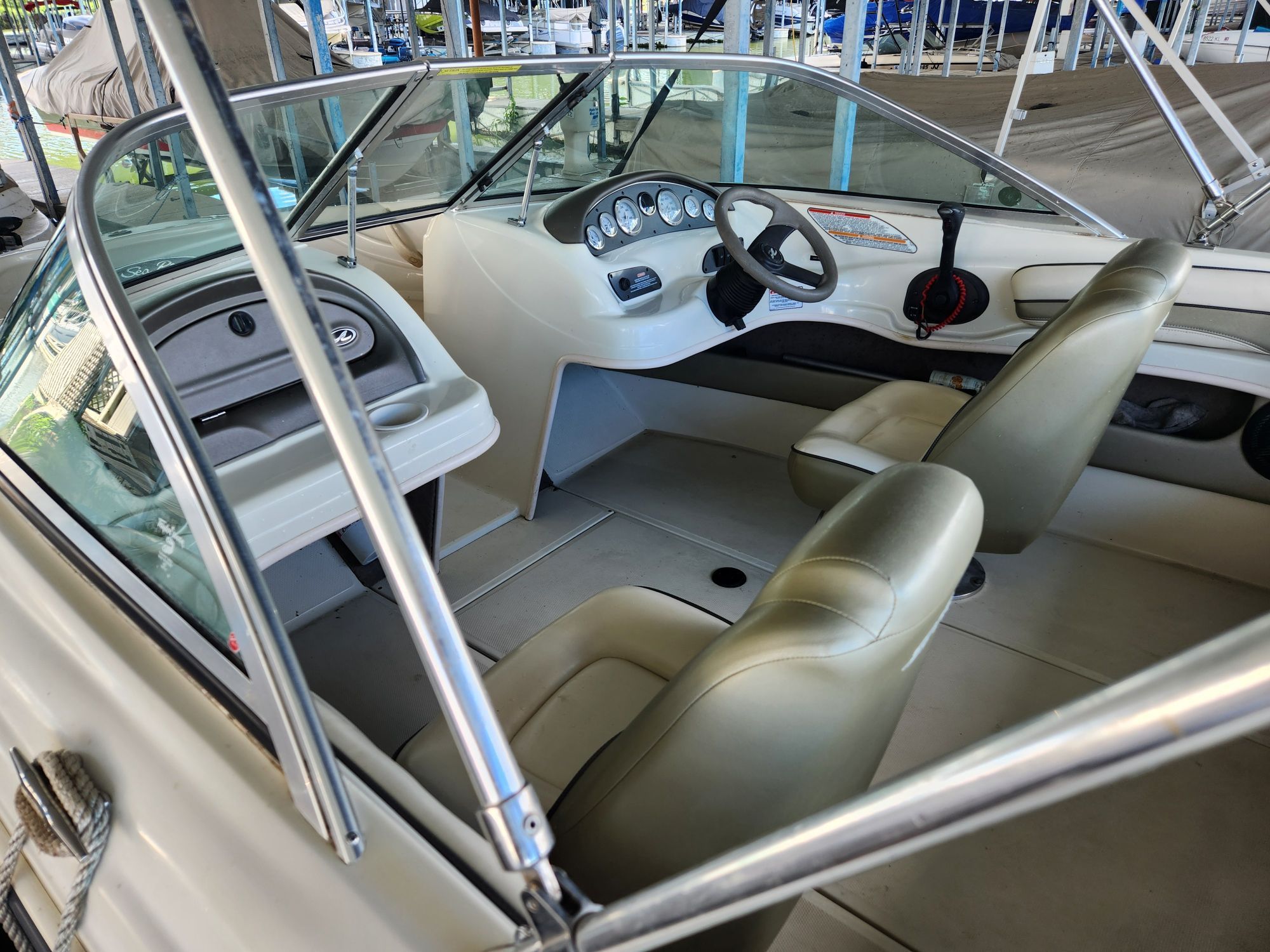 Interior of a 2004 Sea Ray 185 boat with steering console.