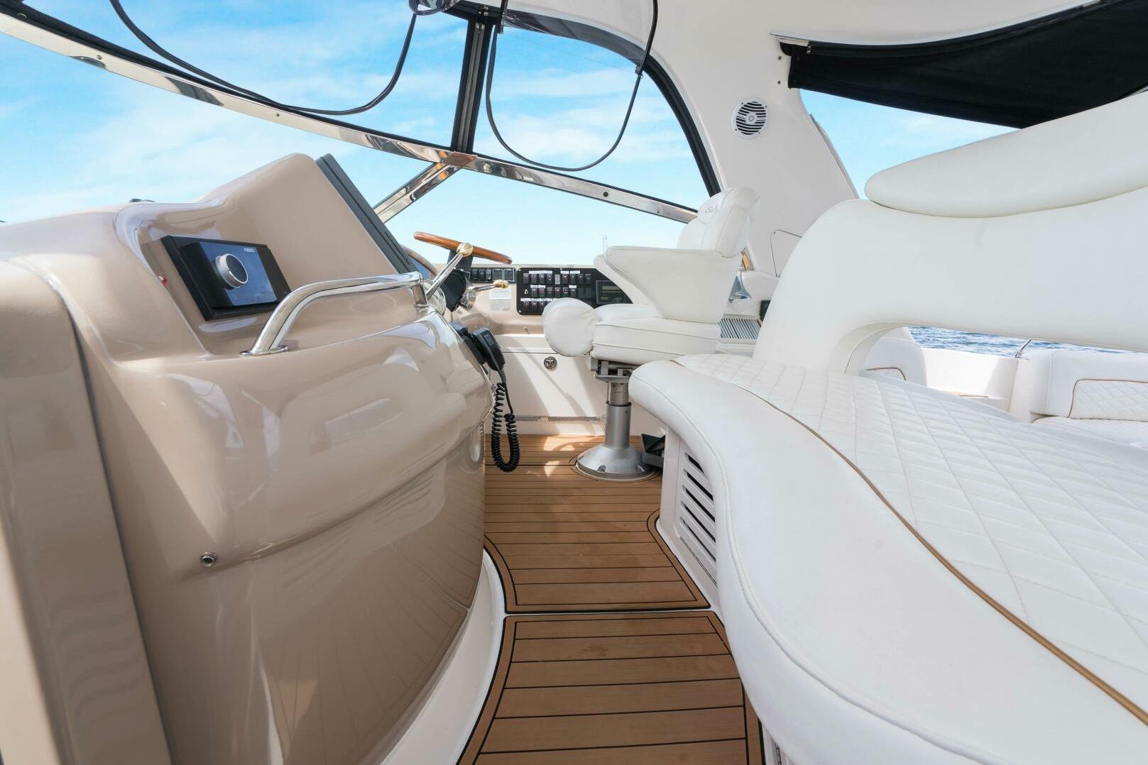 Luxurious interior of 2003 Sea Ray Sundancer 460 yacht with elegant seating and helm.