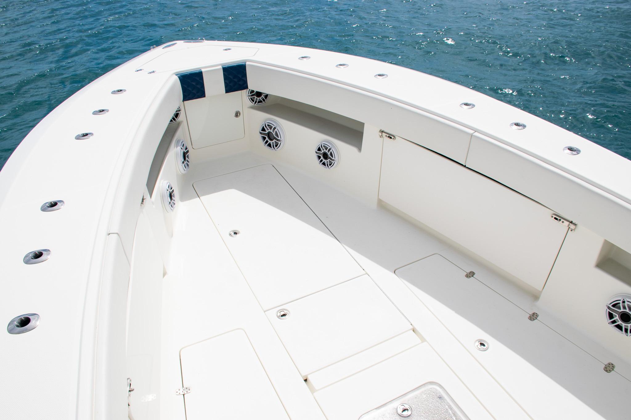 2022 SeaVee 390Z boat deck with storage compartments and ocean view.