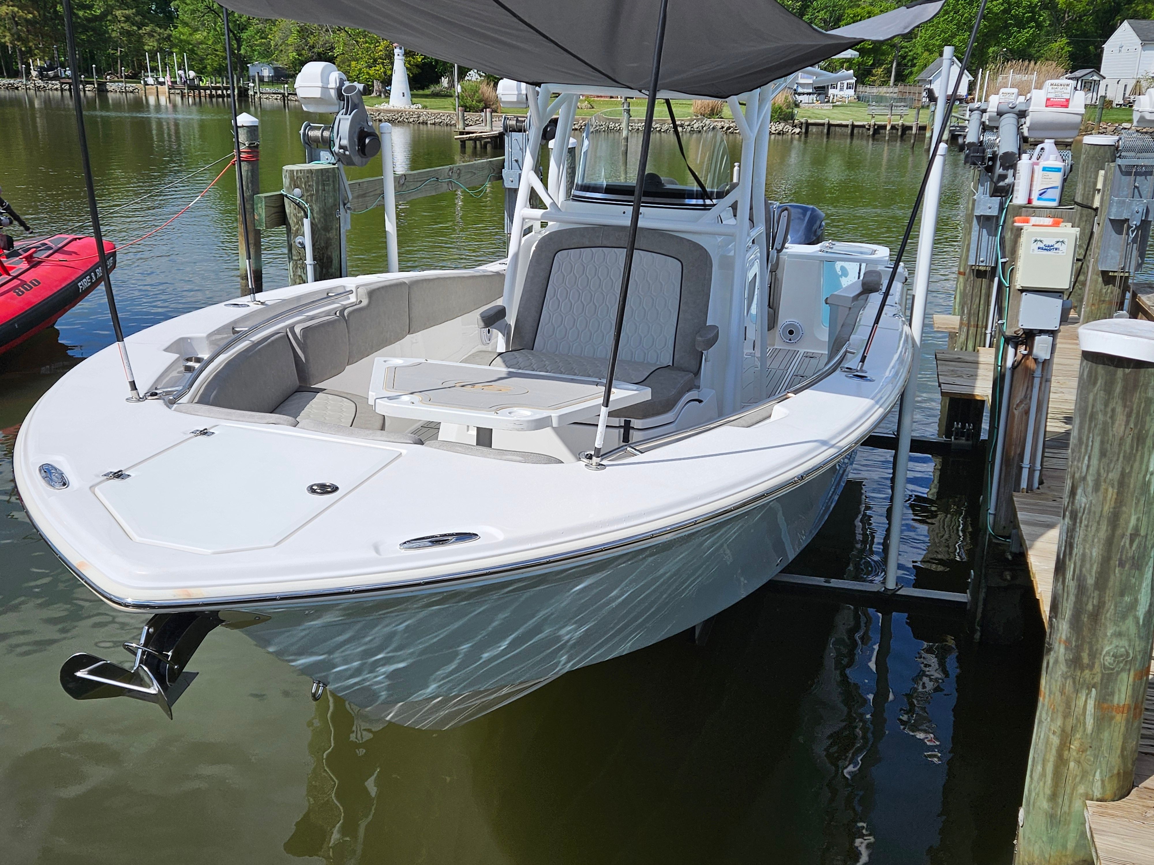 2021 Sea Fox 288 Commander at dock, featuring sunshade.