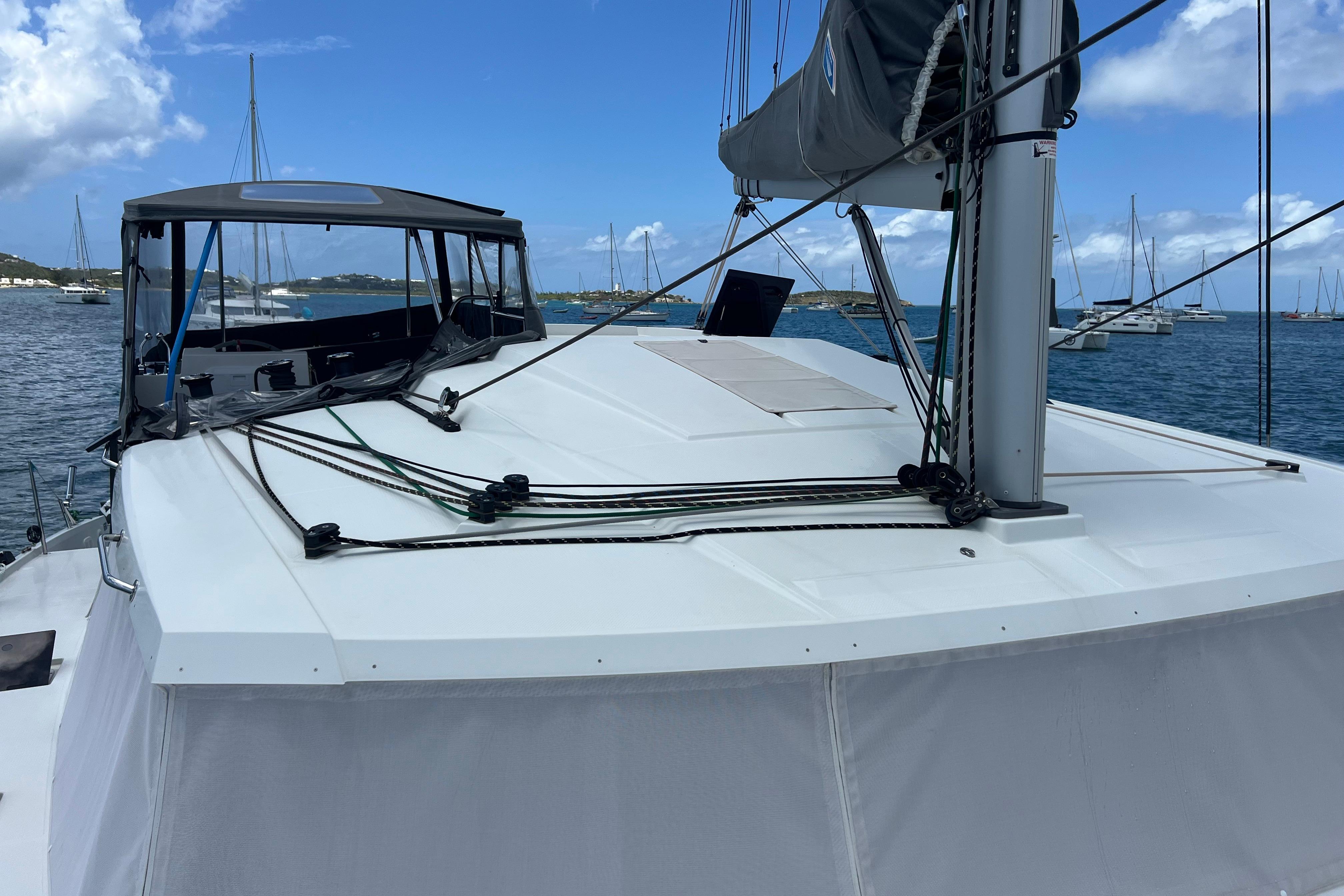 2023 Fountaine Pajot Astrea 42 Catamaran on serene waters, showcasing sleek design and rigging.