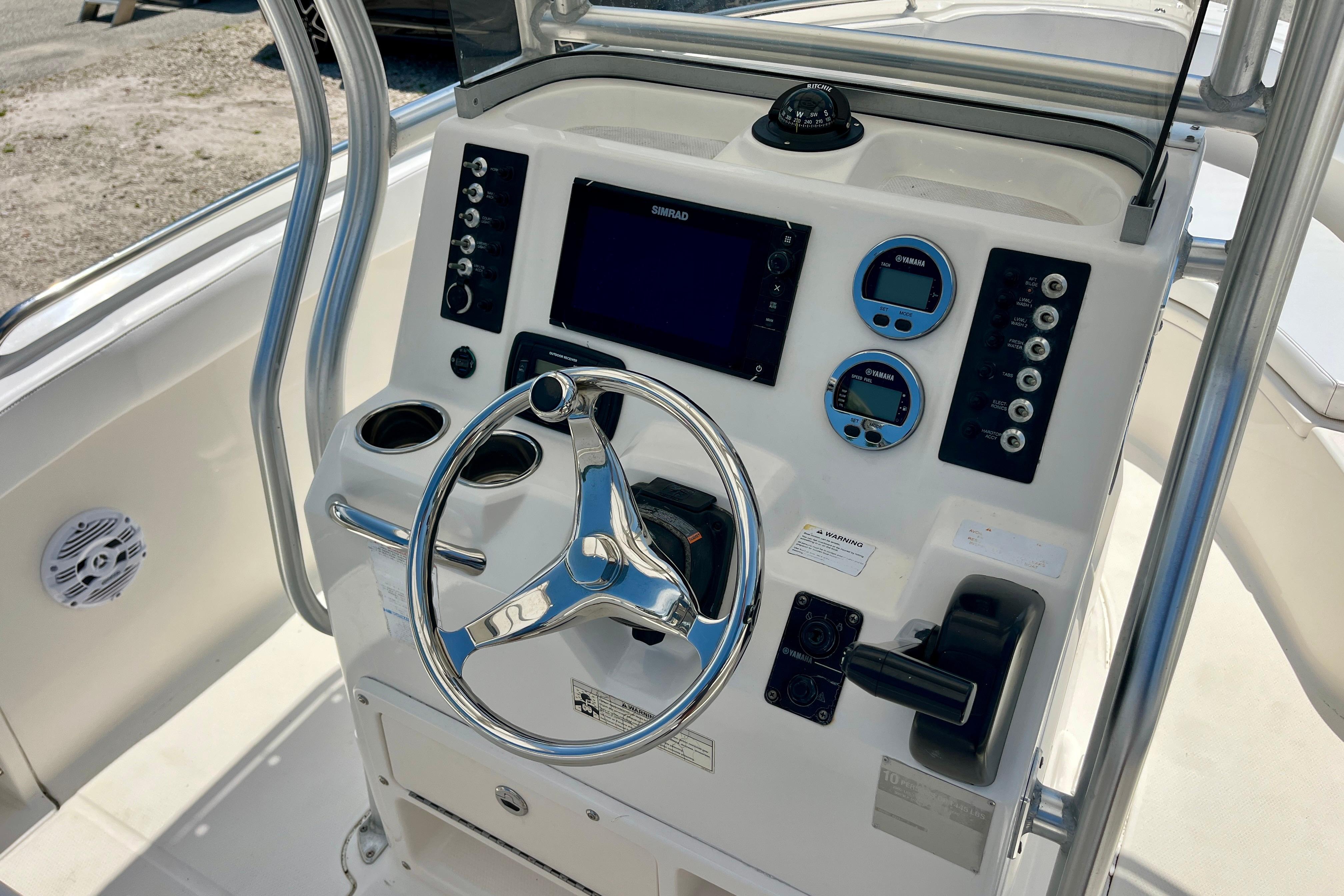 2016 Robalo R222 Center Console boat dashboard with steering wheel and navigation controls.