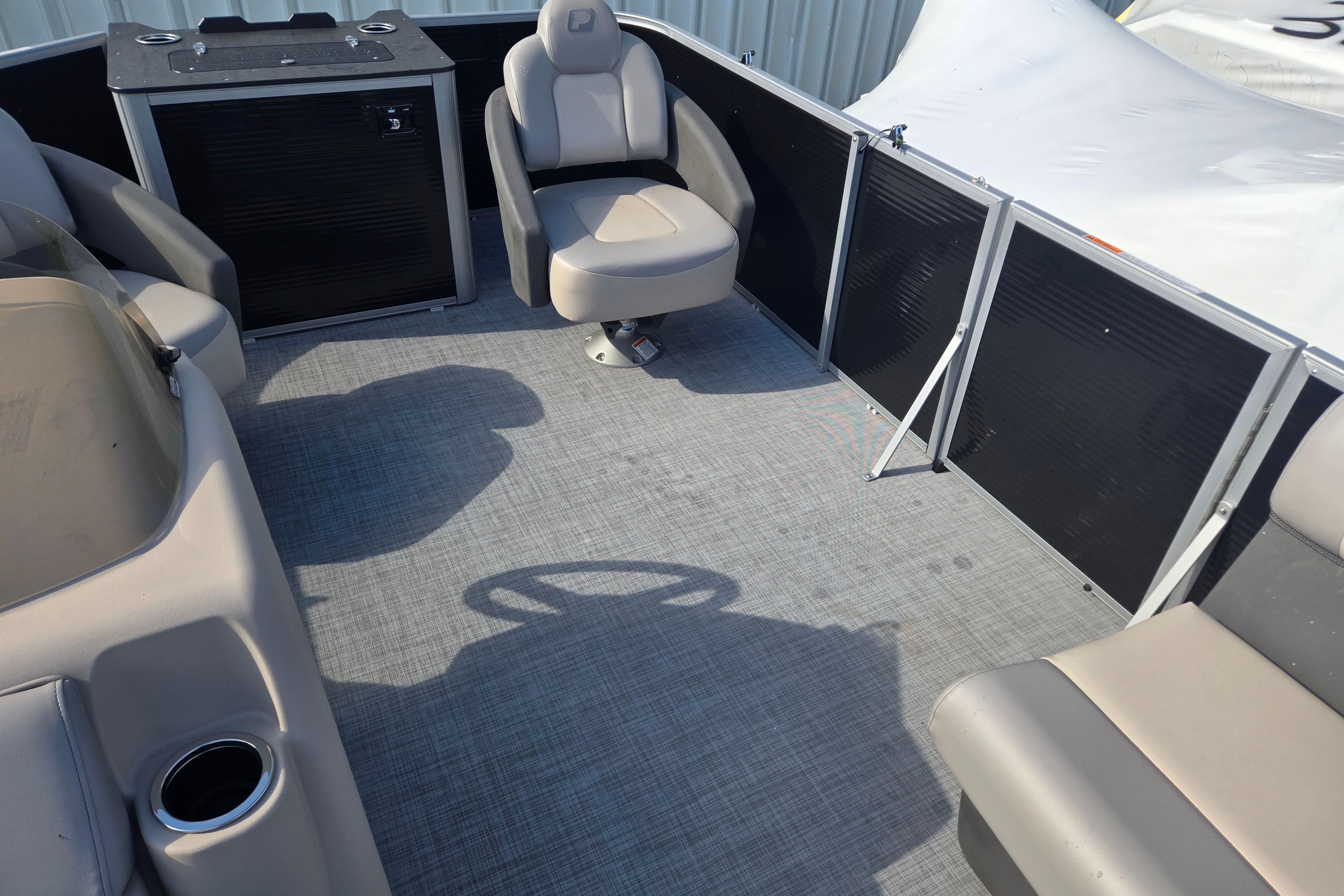 2026 Princecraft Jazz 19-4S pontoon boat interior with seating and steering wheel.
