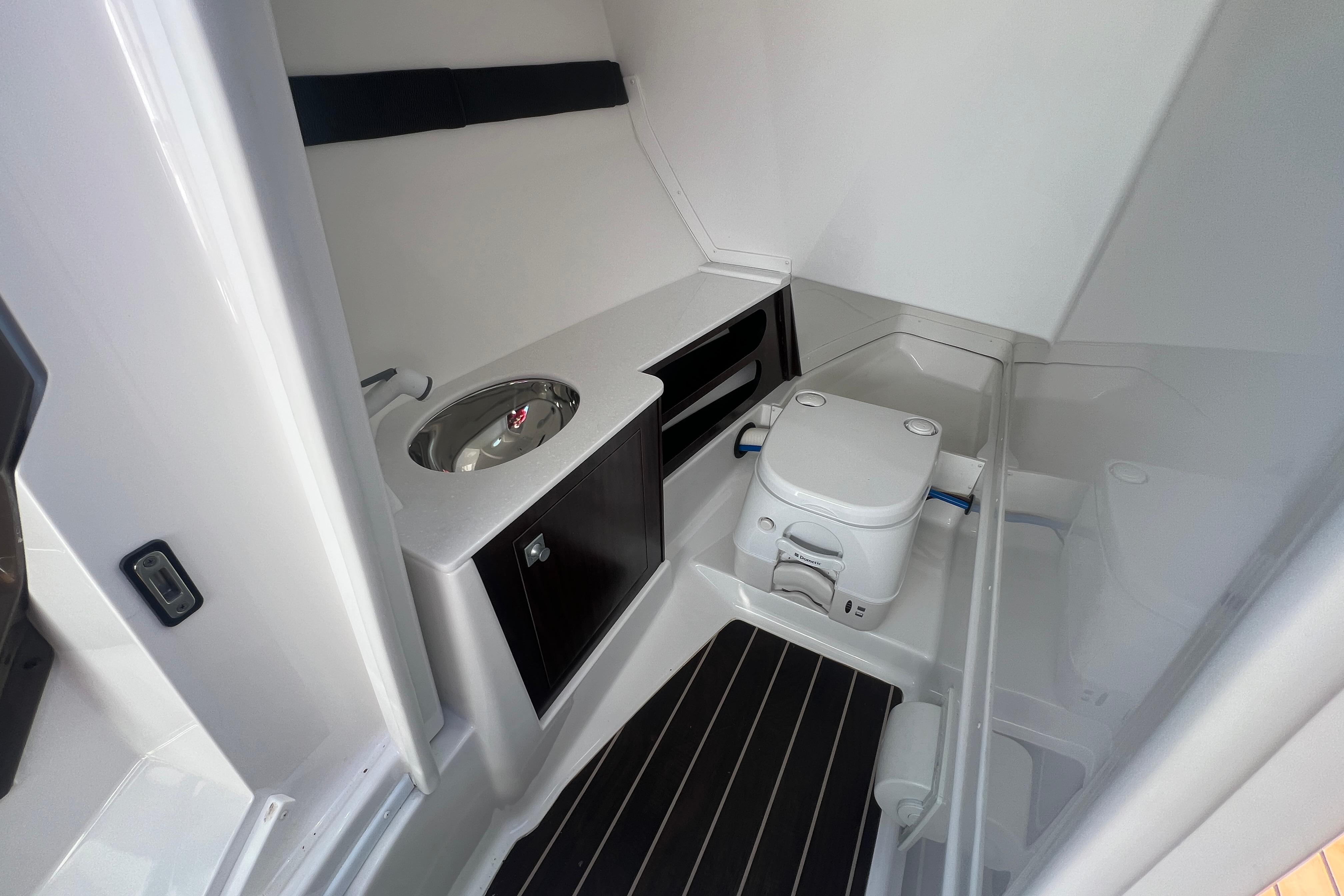 Interior of 2017 Monterey 298SS Super Sport boat bathroom with sink and toilet.