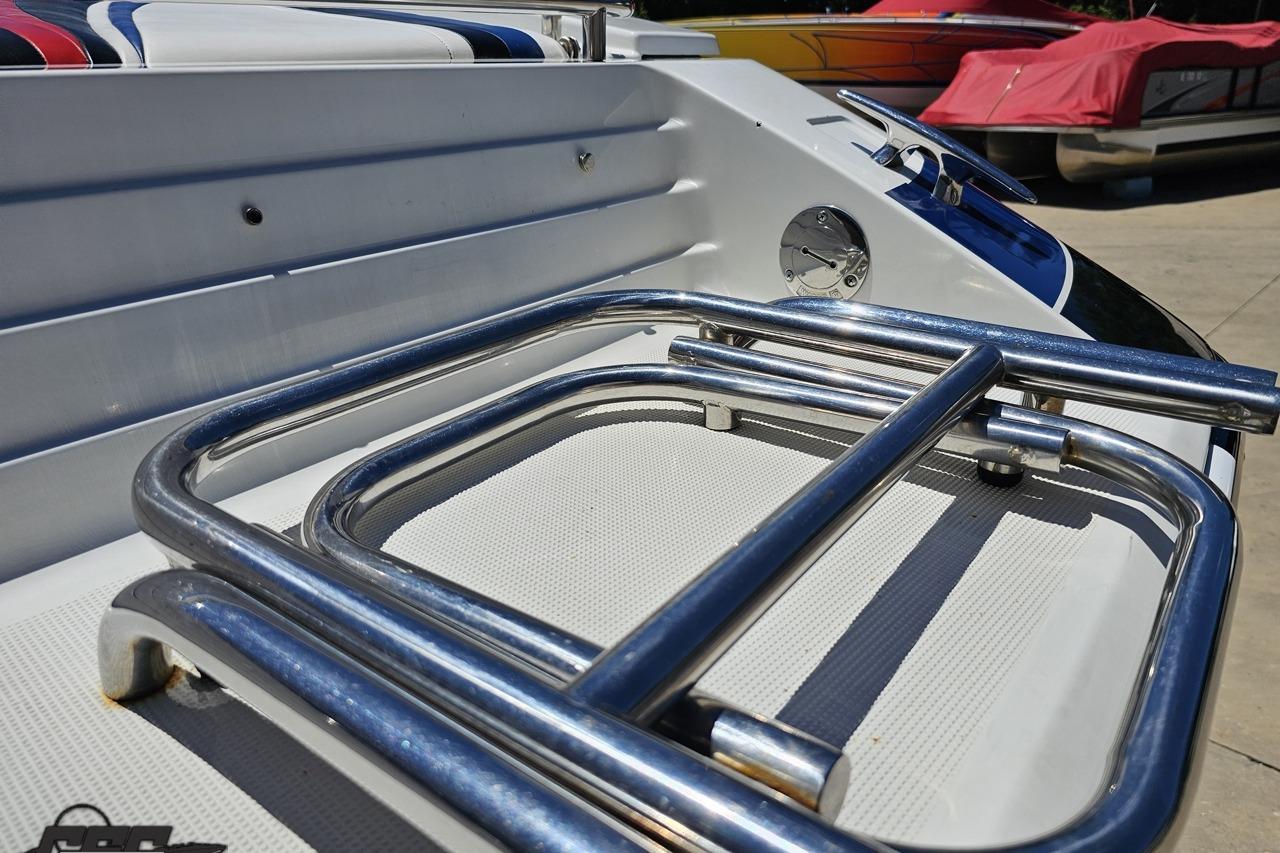 2005 Formula 271 FASTech boat with stainless steel railings and colorful seating.