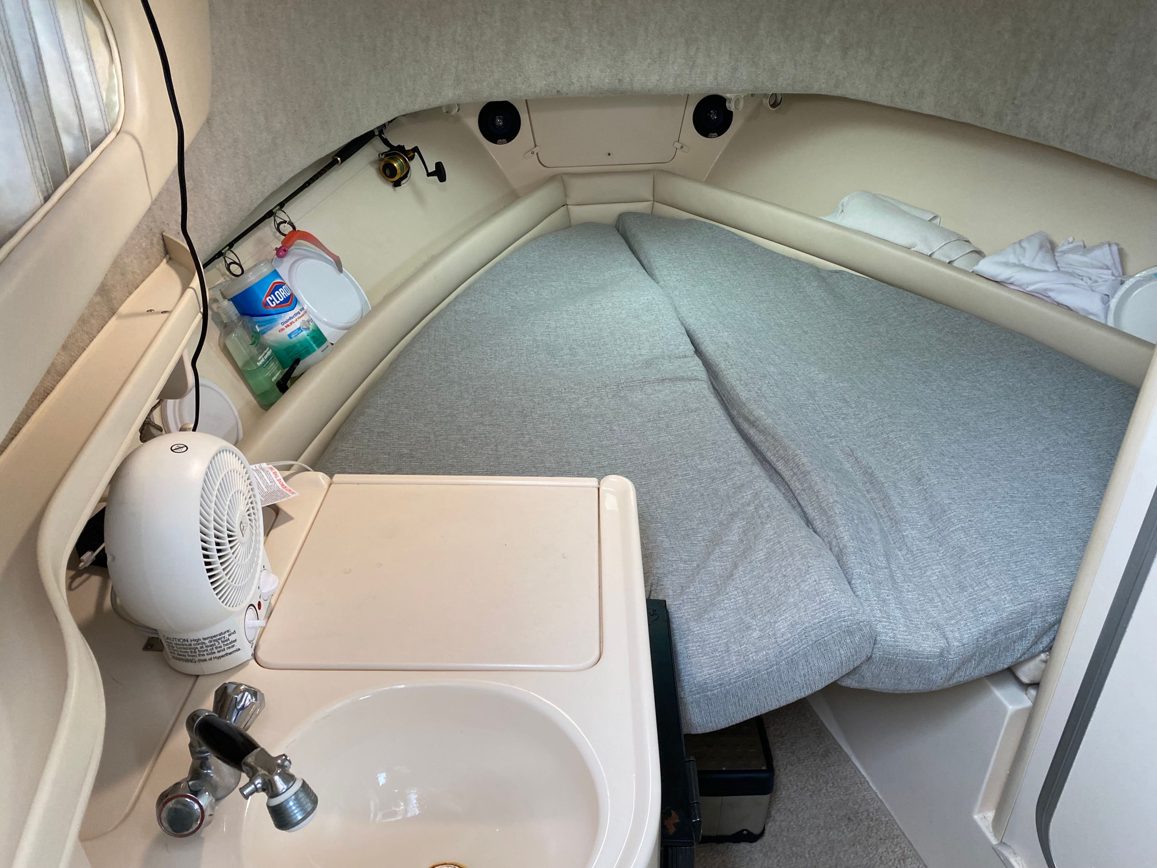 Interior of a 2003 Grady-White Sailfish 282 featuring a sleeping area and sink.