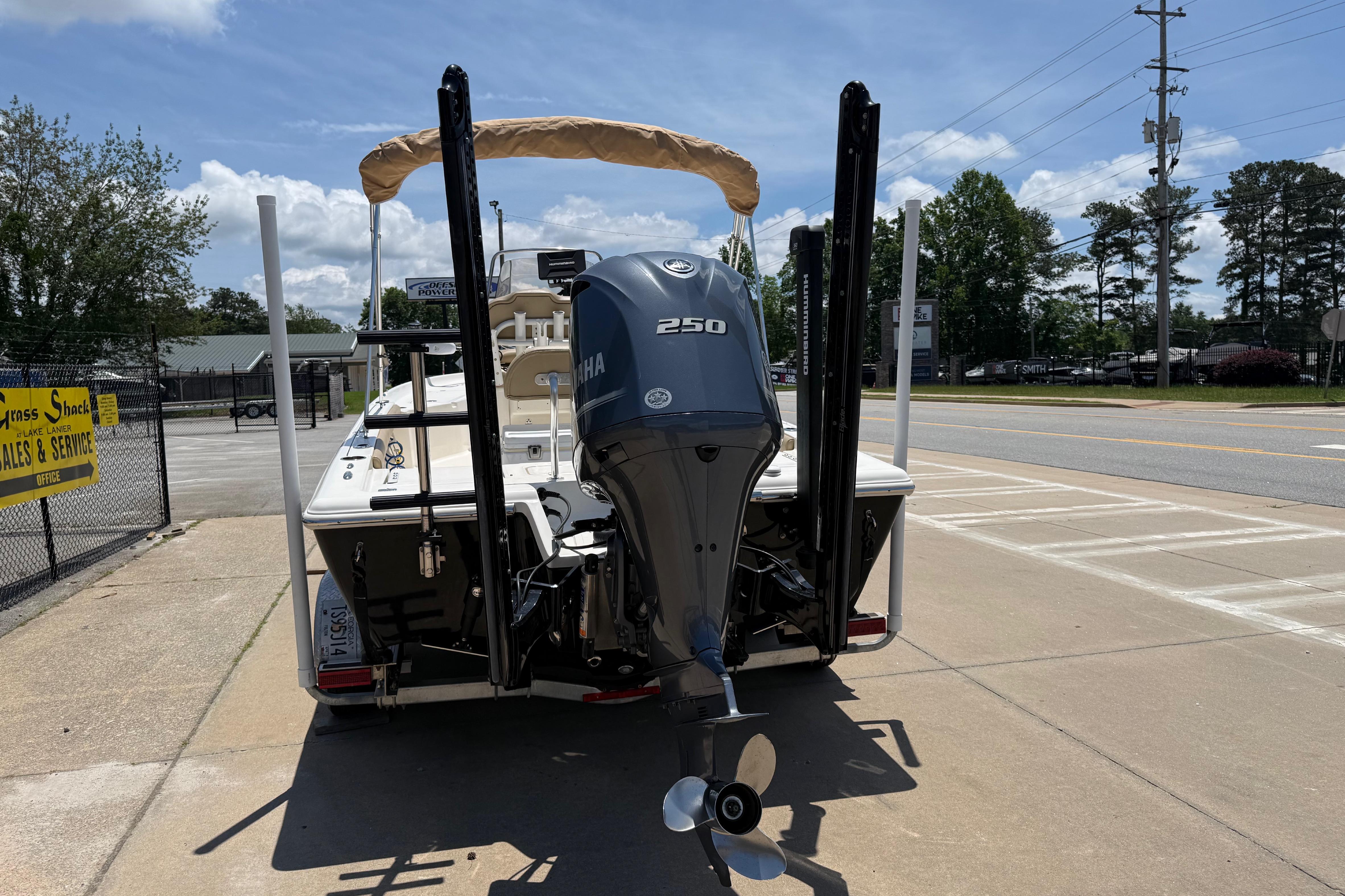 2019 Key West 230 Bay Reef boat with Yamaha 250 engine, parked outdoors.